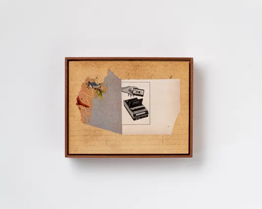Image of a paper collage on stained lined paper in a wooden frame. The collage is composed of two images: the left is a map of the southeast coast of the US with a bluejay over MA and the right is a black and white image of a hand holding a tape above a cassette player.
