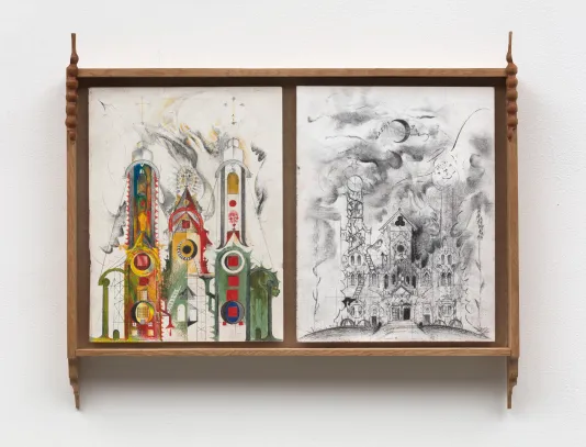 Two drawings, both of churches, are set side-by-side in a wooden frame with carved ornamentation and pointy finals at each corner. In the drawing at left, geometric forms in bright, primary colors wash the façade of a cathedral-like structure with many steeples. The drawing at right, executed in graphite with heavy shading, could be a zoomed-out view of the same building, and features a moody, swirling sky with a crescent moon flanked by text reading SAINT ANN rising above the spires. 