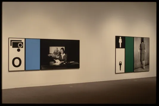 Two artworks are hung next to each other on the wall. Both contain three sections: a figure, a color, and relating symbols. 