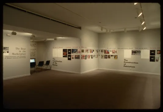 A view of the gallery showing advertisements going around the walls with section headers running beneath them.