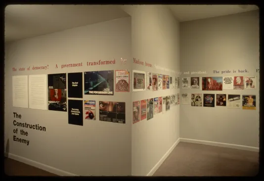 A corner of the gallery showing advertisements running in two rows around the wall with text running above them.