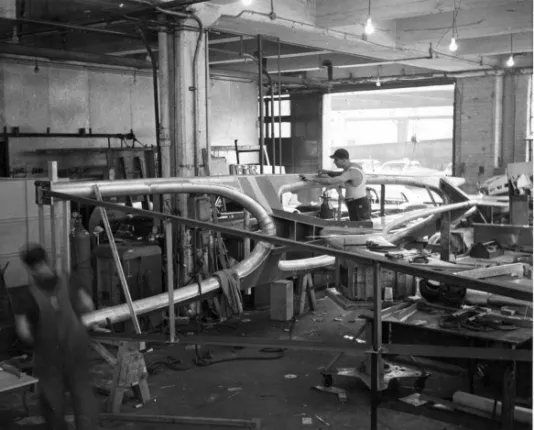 An image shows people working on the fabrication for the sculpture meant to go on top of the MIT Bell Tower.