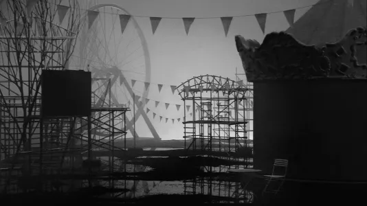 Silhouetted in hazy back light, the shapes of a circus tent, ferrous wheel, viewing stands and 4 strands of triangular flags.
