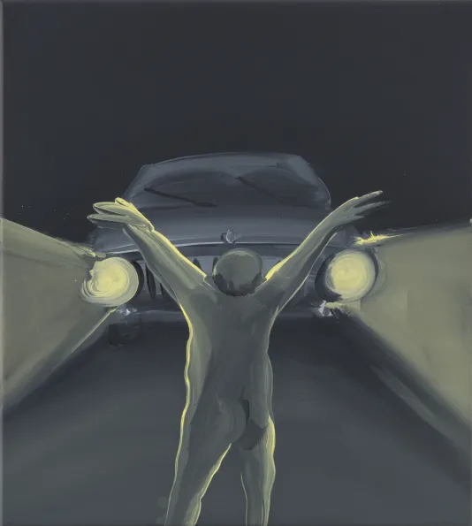 Lit by yellow beams from headlights of oncoming car, naked male figure stands with out-stretched arms and back toward viewer.
