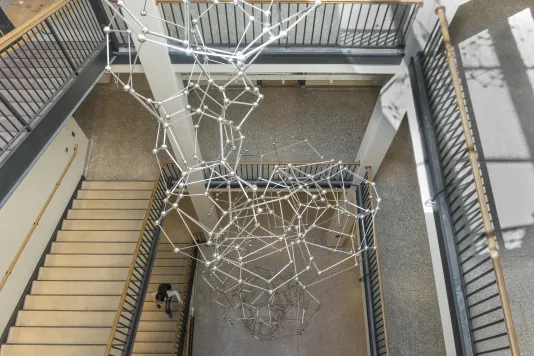 Sculpture made of thirty-three stainless steel polyhedrons reaching from the floor of the Simons Building to the skylight four stories above
