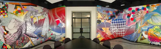 Three-dimensional reliefs in a conference room with exuberant forms and colors