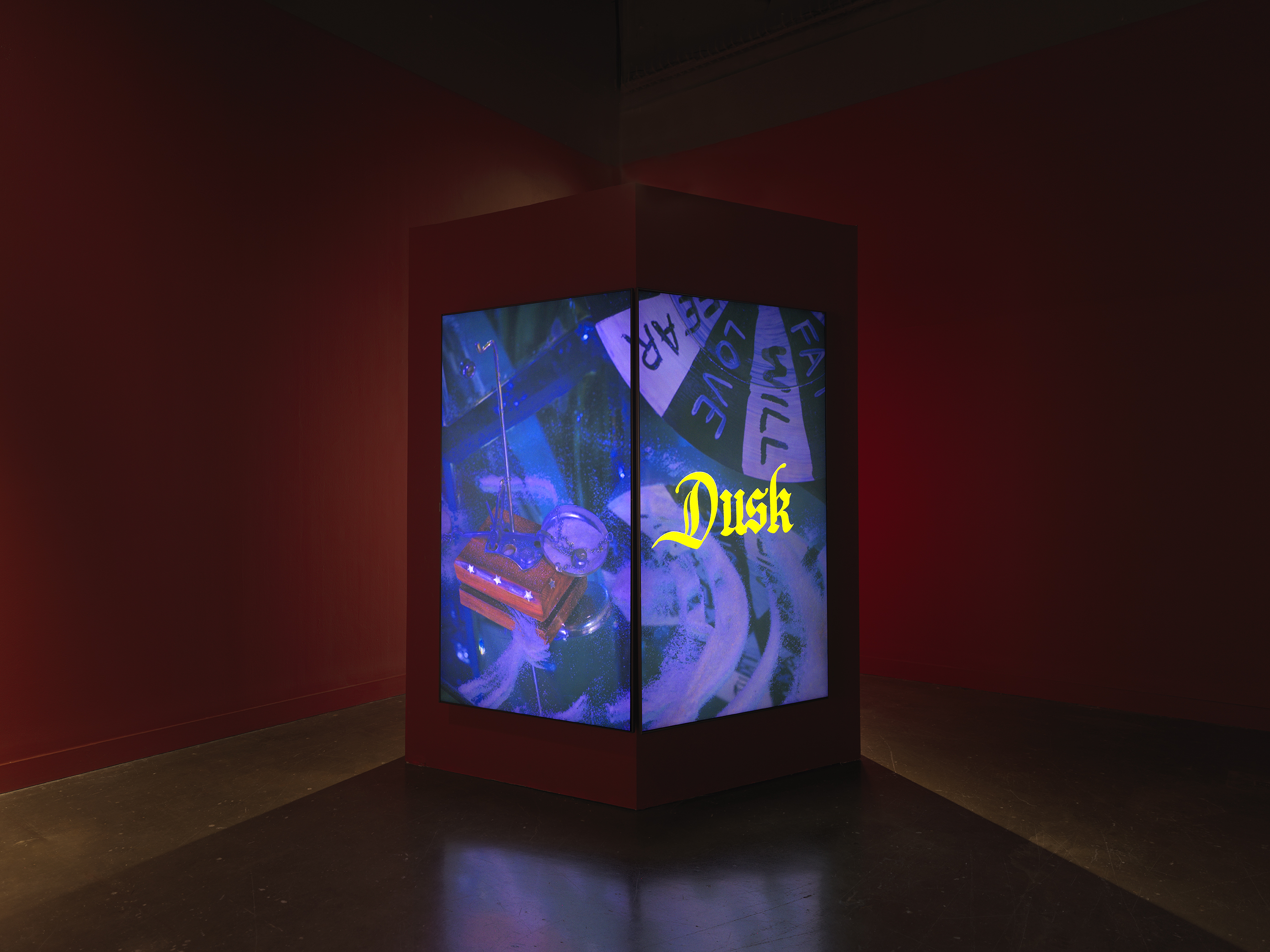 Two adjacent screens show a blue-tinted tableau, the right screen overlaid with the word “Dusk” in yellow, gothic font.