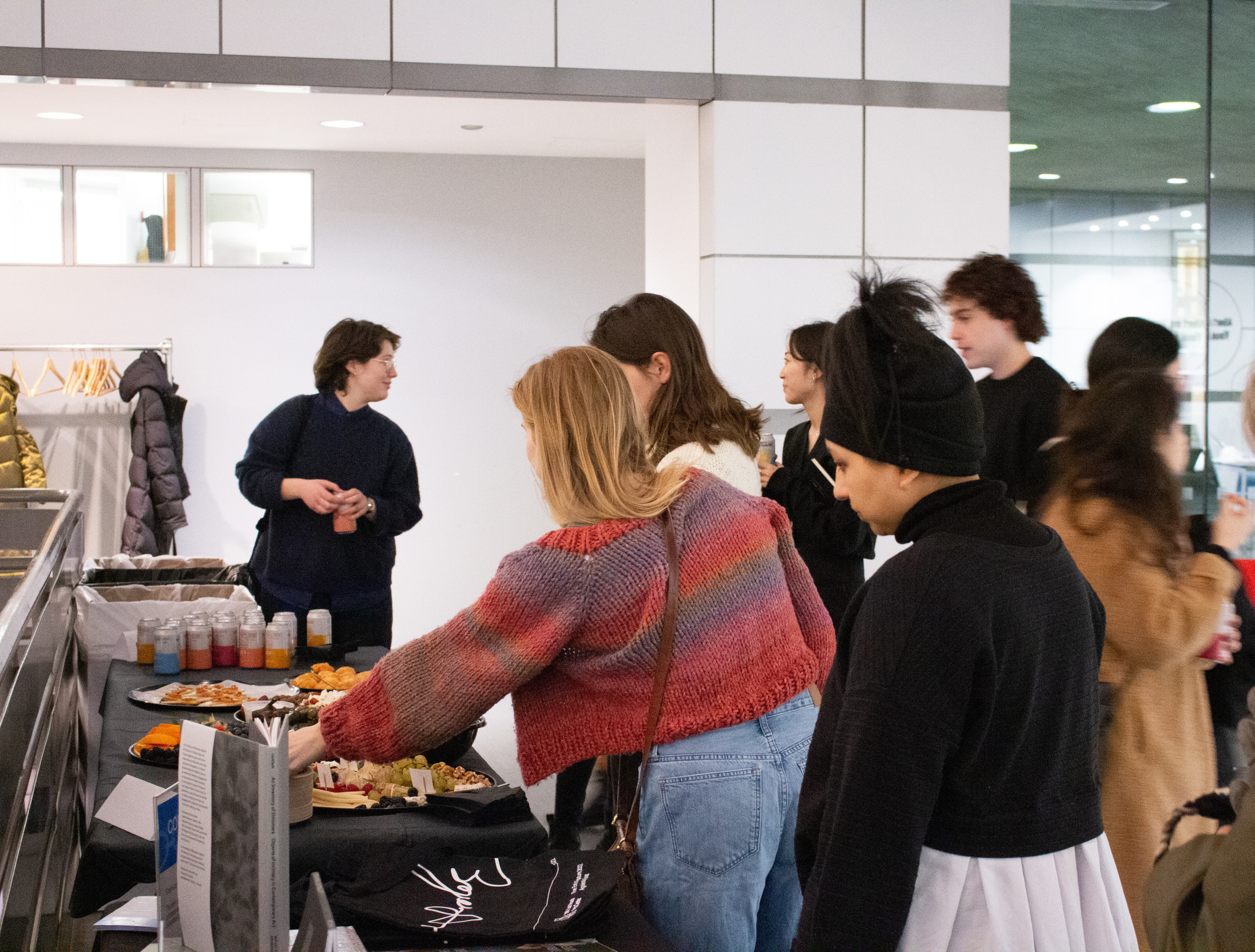 Image of attendees congregating in the atrium for the Connect at the List event in the MIT List Visual Arts Center.