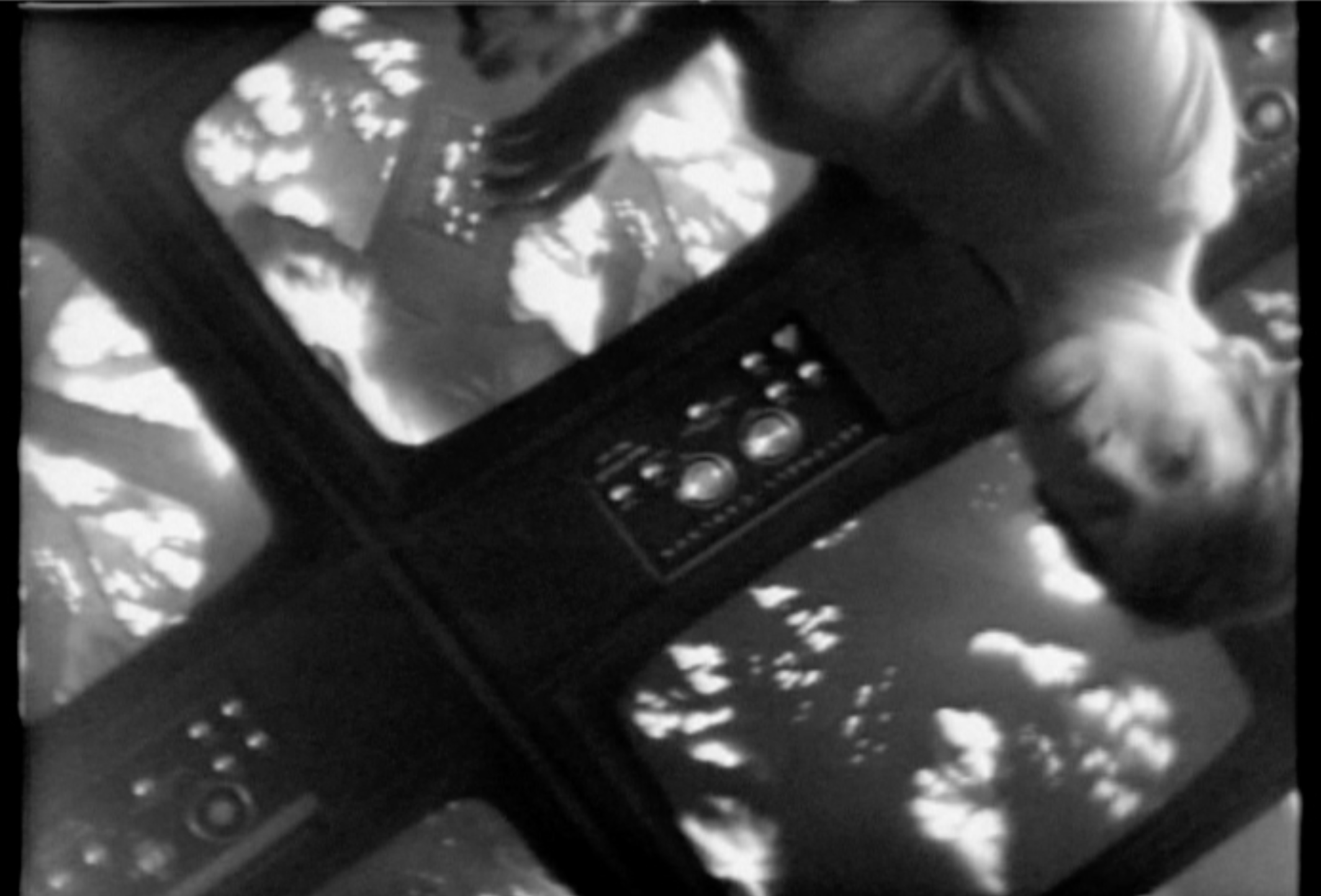 Video still from black and white video by artist Steina featuring Steina.