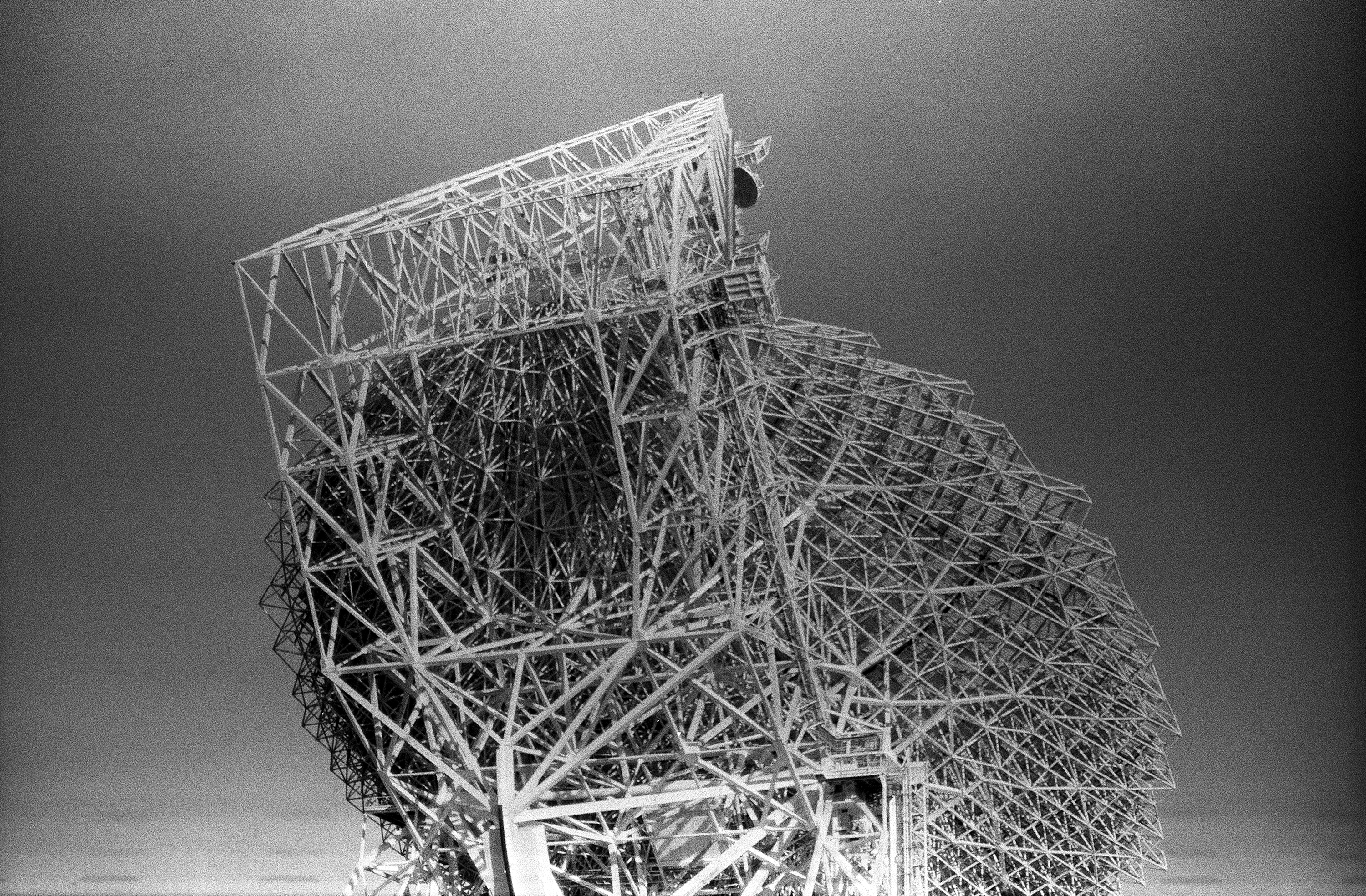 Black and whte image of a large architectural sculpture made from scaffolding.
