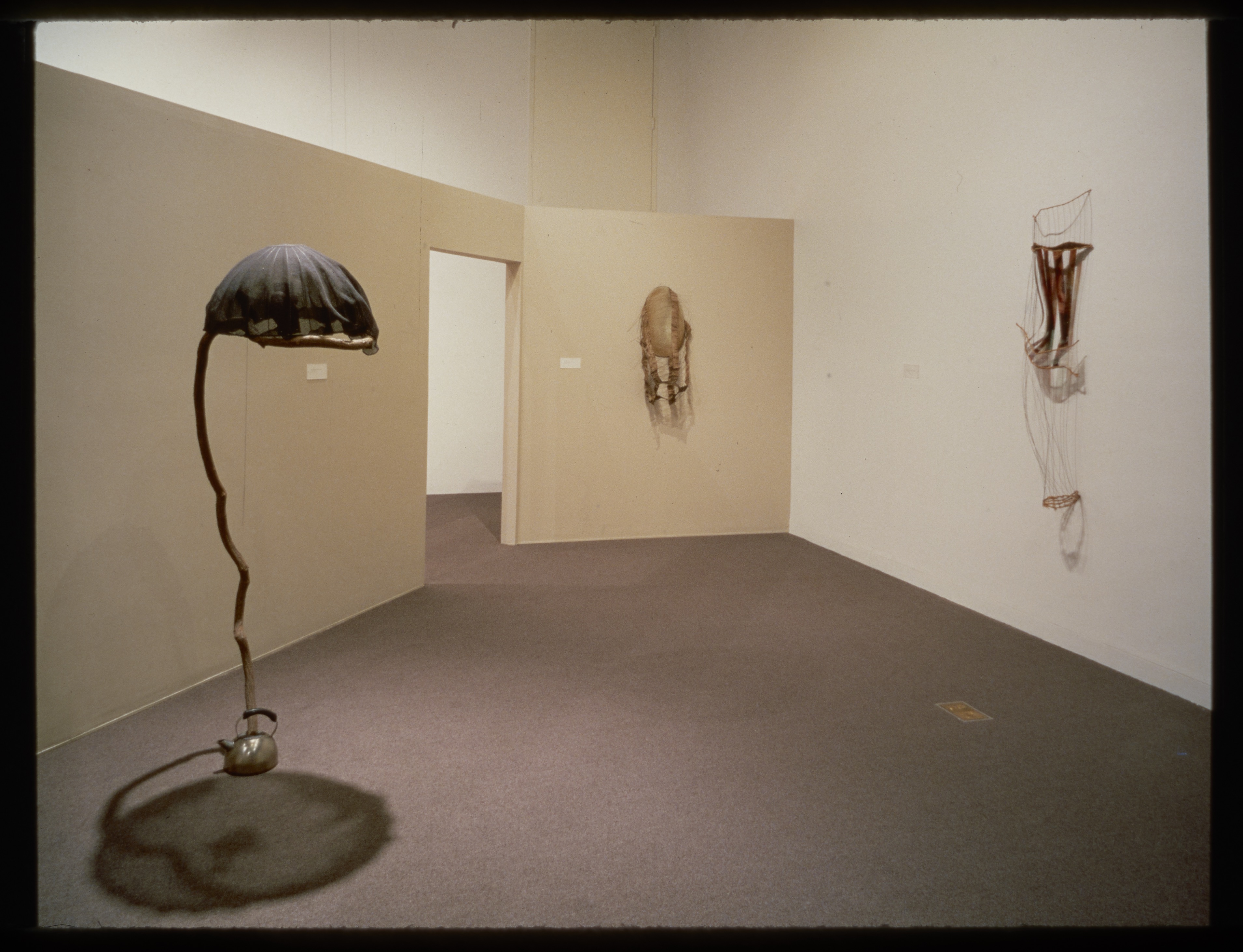 Abstract sculptures are shown both free tanding and hung on the gallery wall. Each is made with various materials.