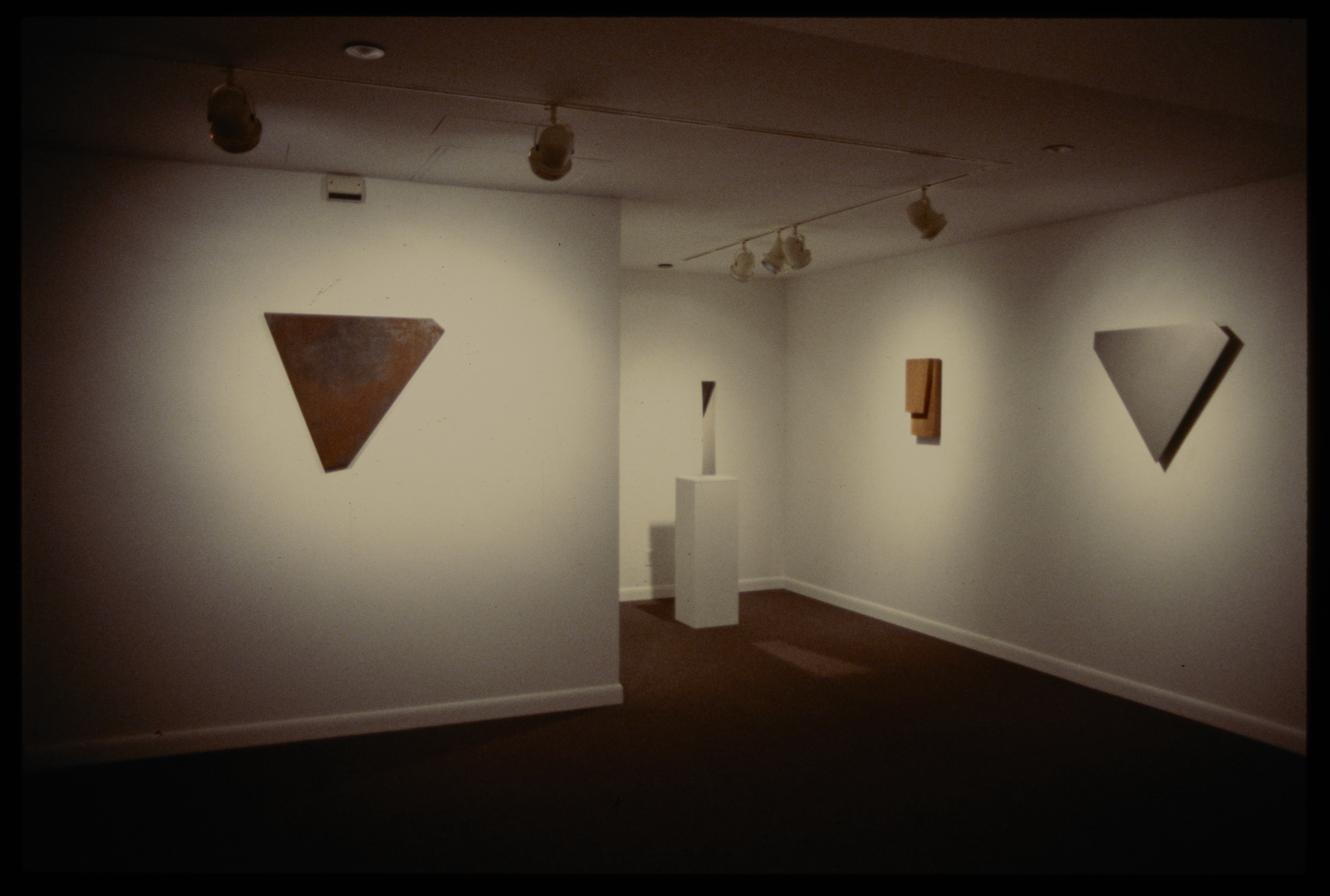 Form studies are both hanging on the walls and displayed on pedestals. Each study has its own unique shape and form.