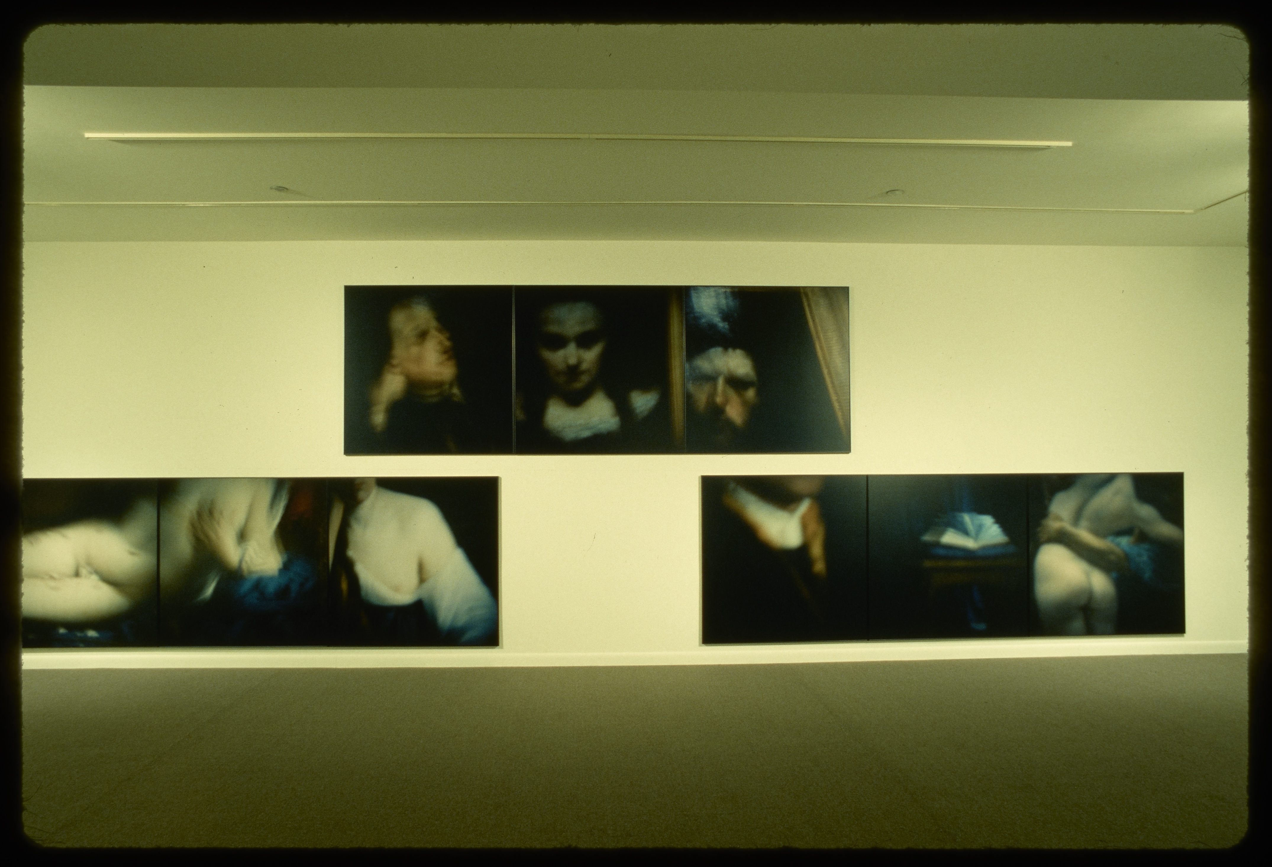 Triptychs line the walls of the gallery. Each of the three pieces in the triptics shows a detail from a historical artwork.