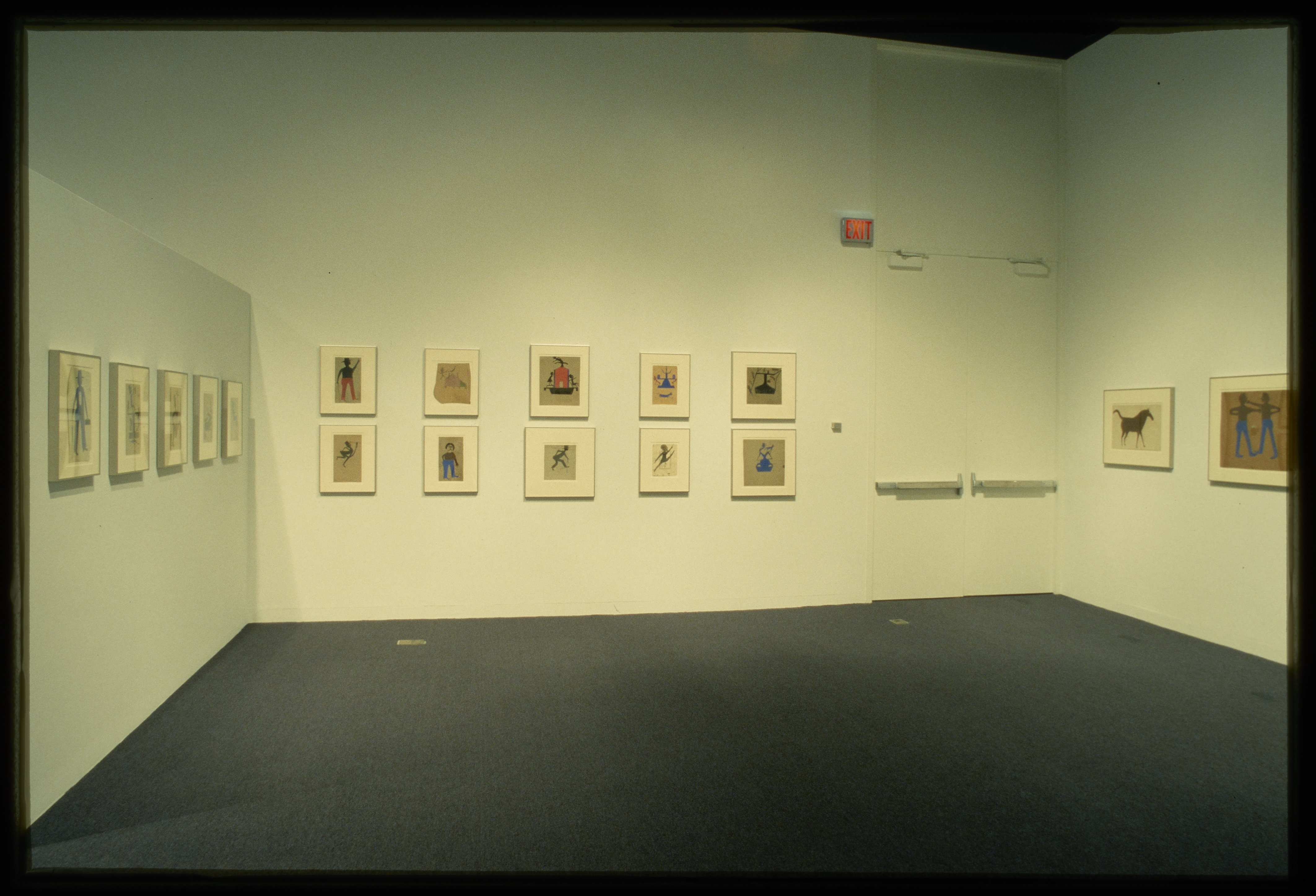 Framed drawings of figures and animals are hung on the gallery walls. 
