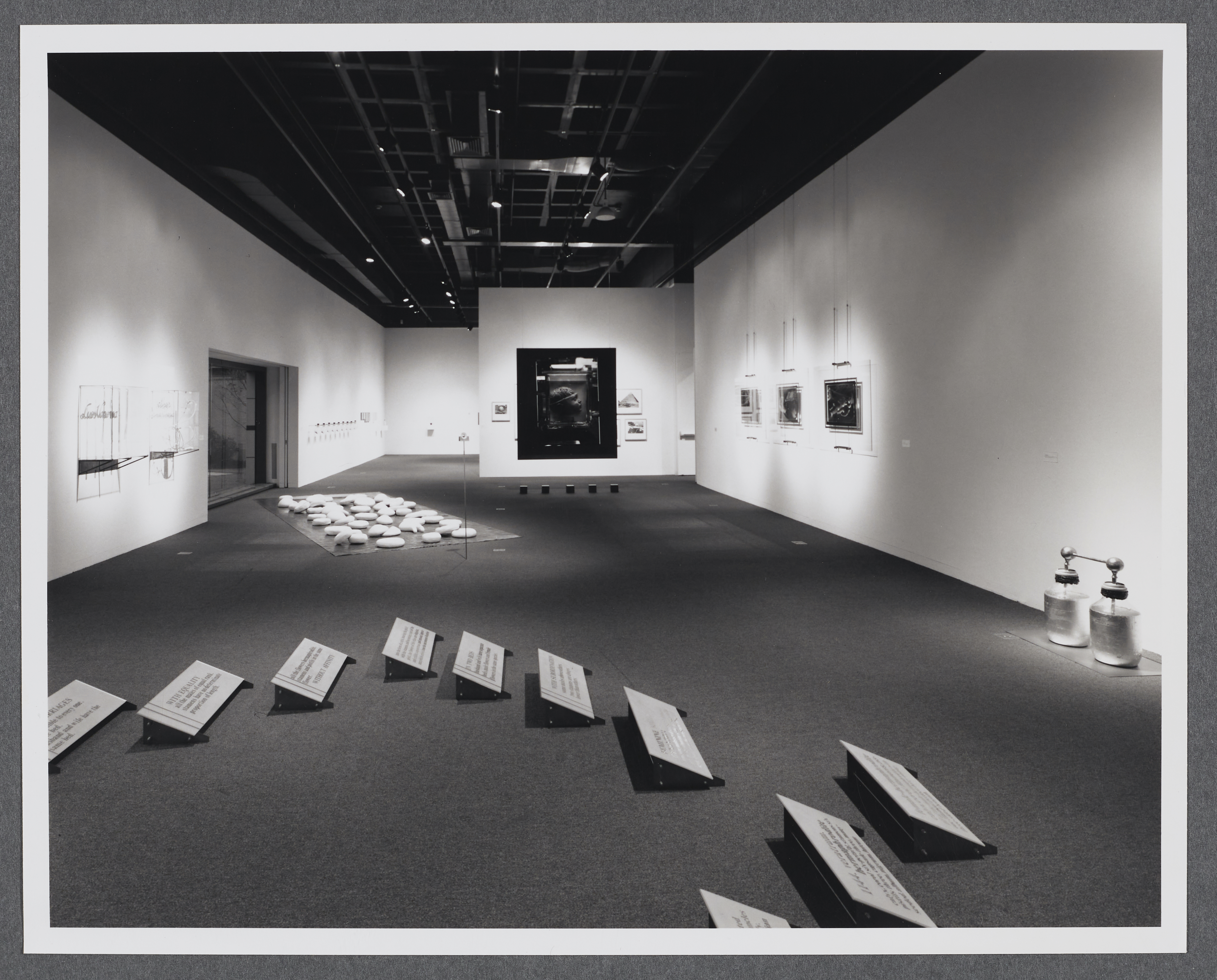 An installation view of the gallery with floor installations as well as works going around the gallery walls.