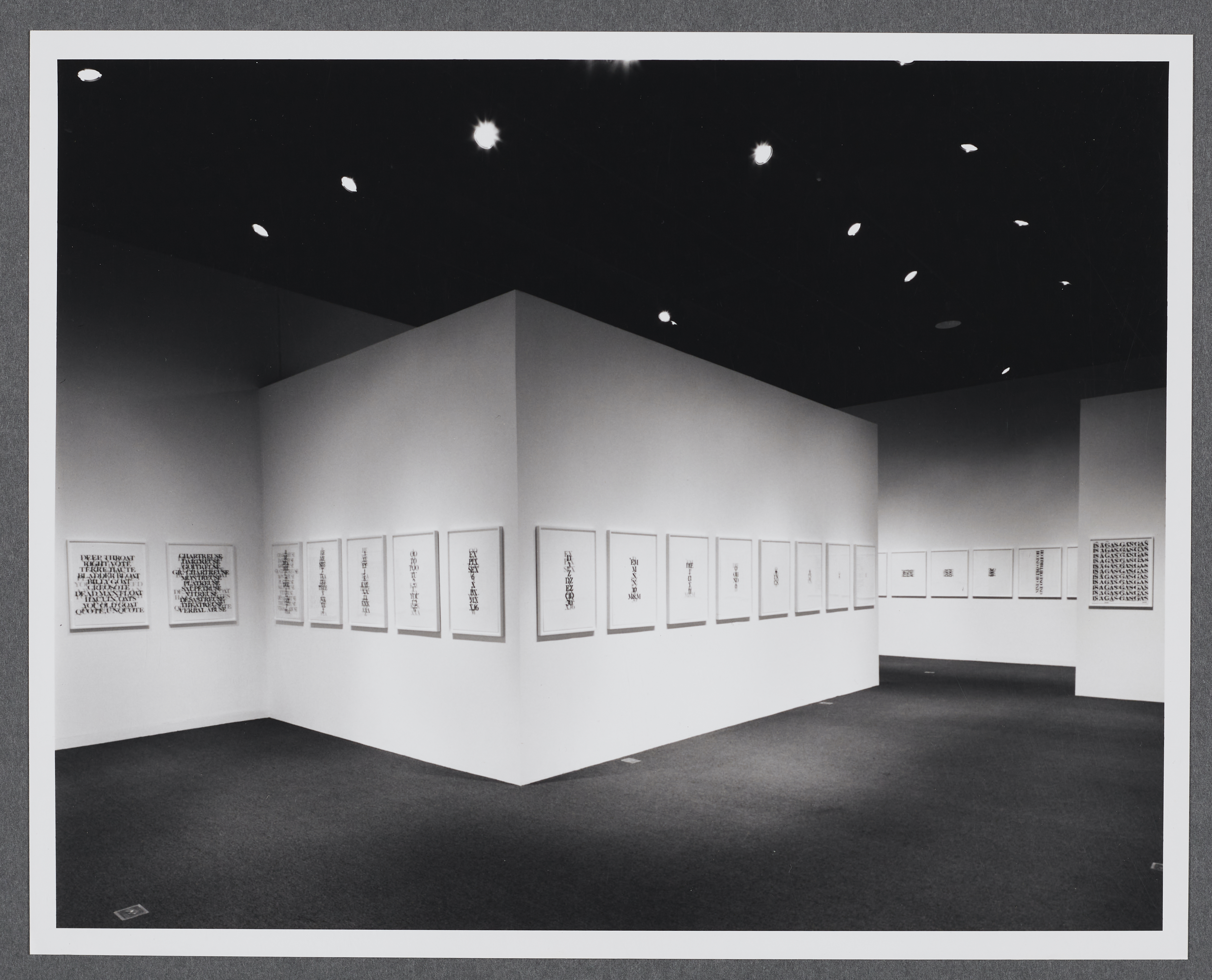 Works of the same size are displayed in a row that goes all around the gallery. Gallery walls create extra space within the room.