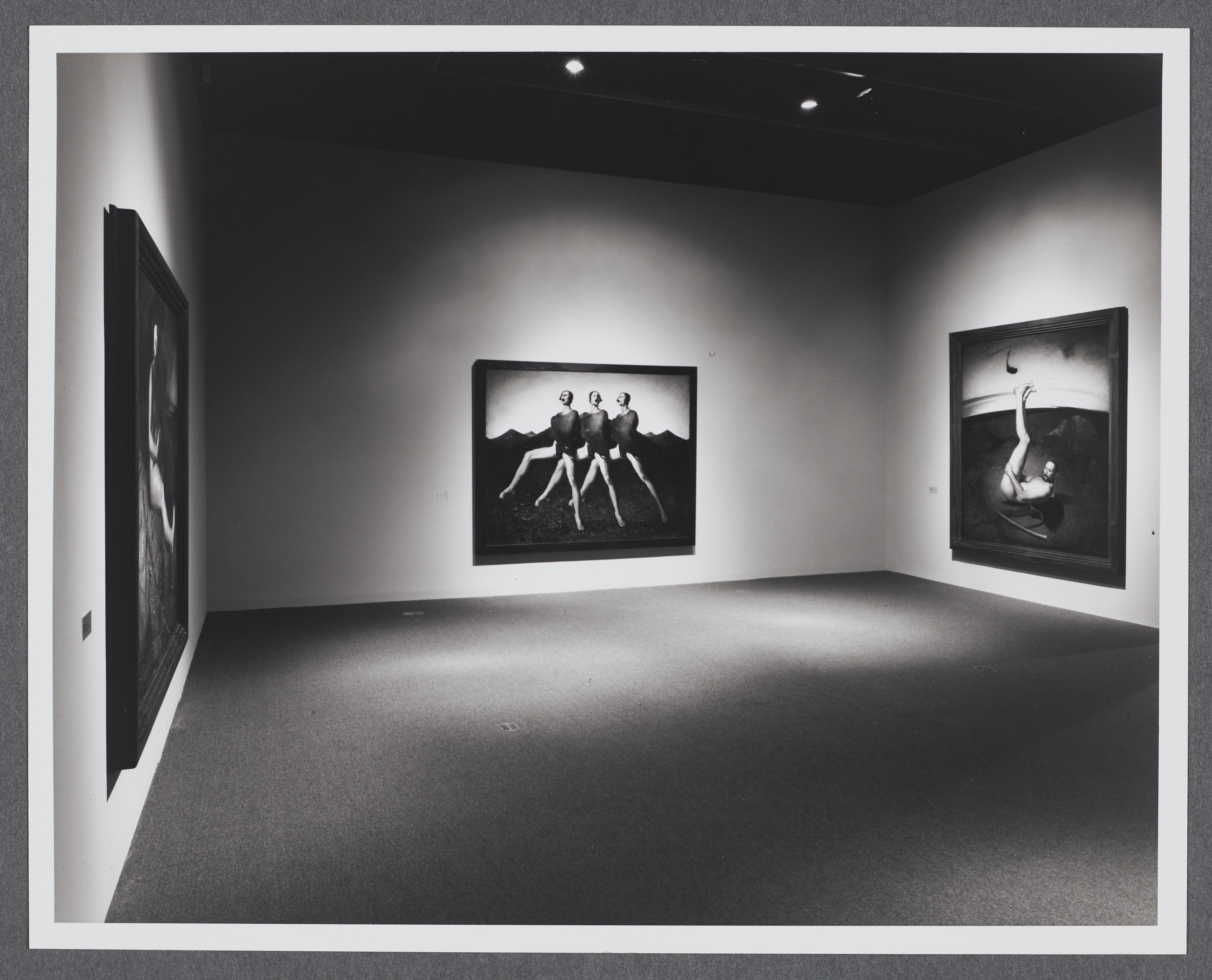 Large figurative paintings take up the gallery. Each painting has figures in a variety of poses and in different settings.