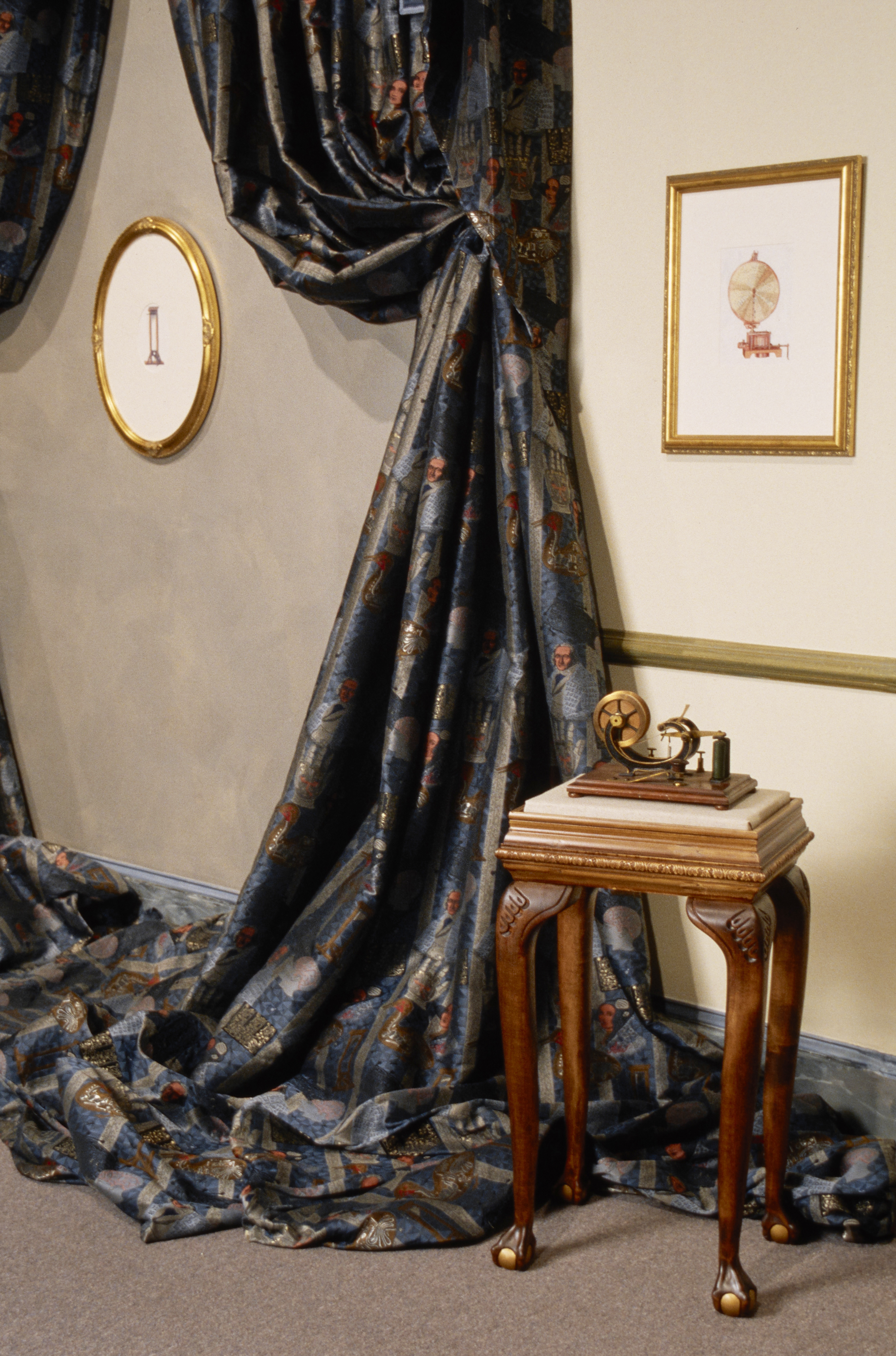 Telegraph on display table, 2 illustrations in gilded frames and drapery made of Jacquard fabric, woven for the exhibition