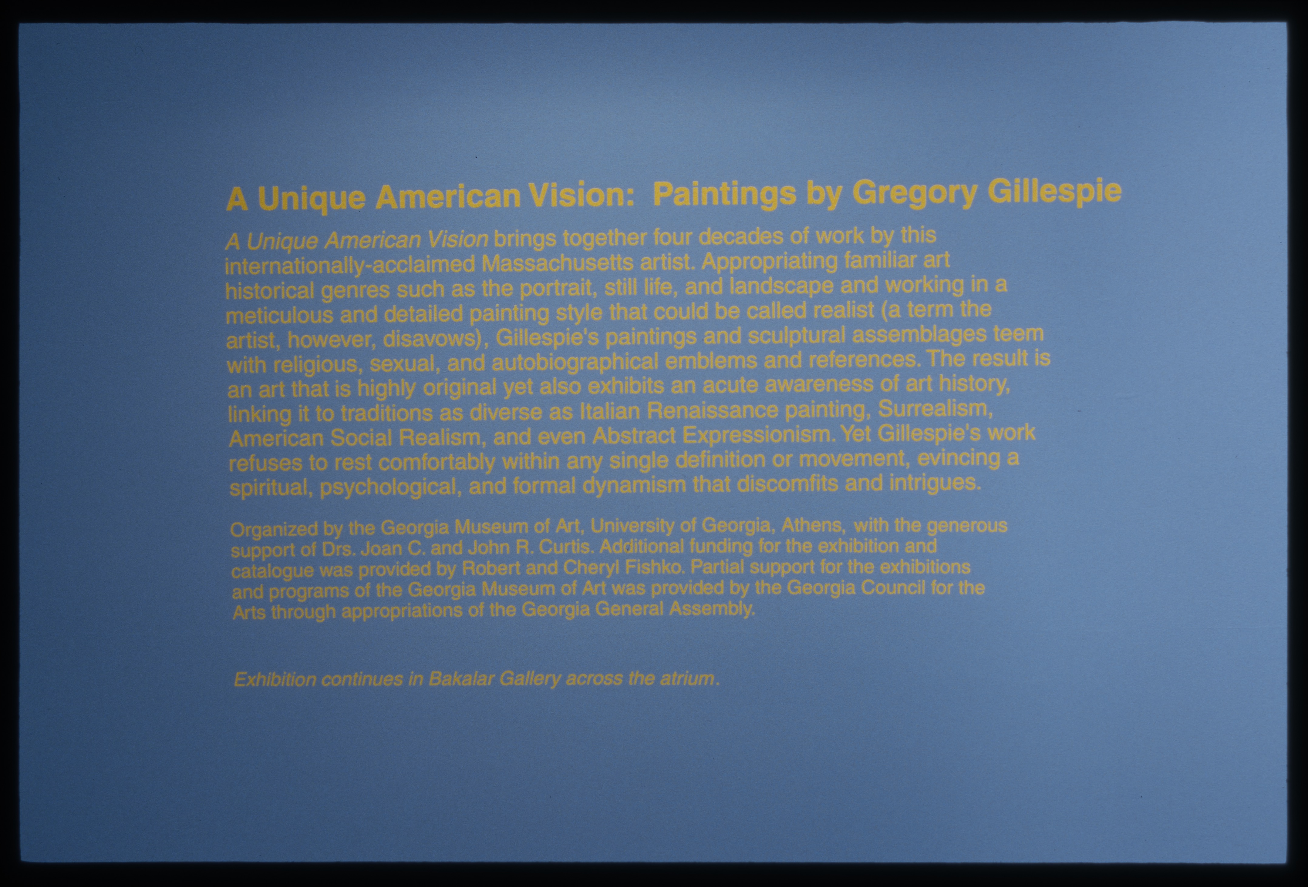 A blue wall with the welcome text to the space: A Unique American Vision.