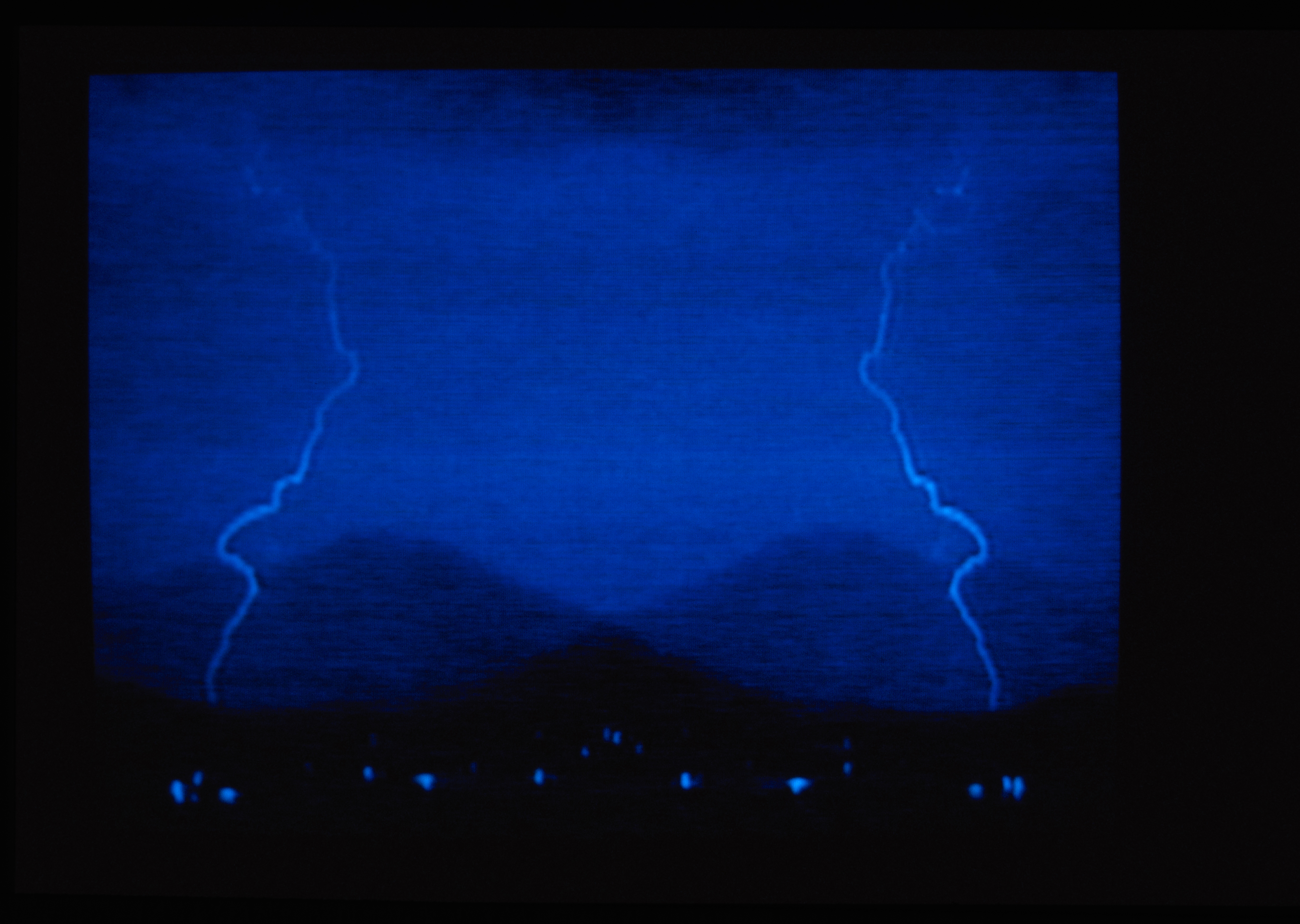 A photograph resembling lightning on a blue background.