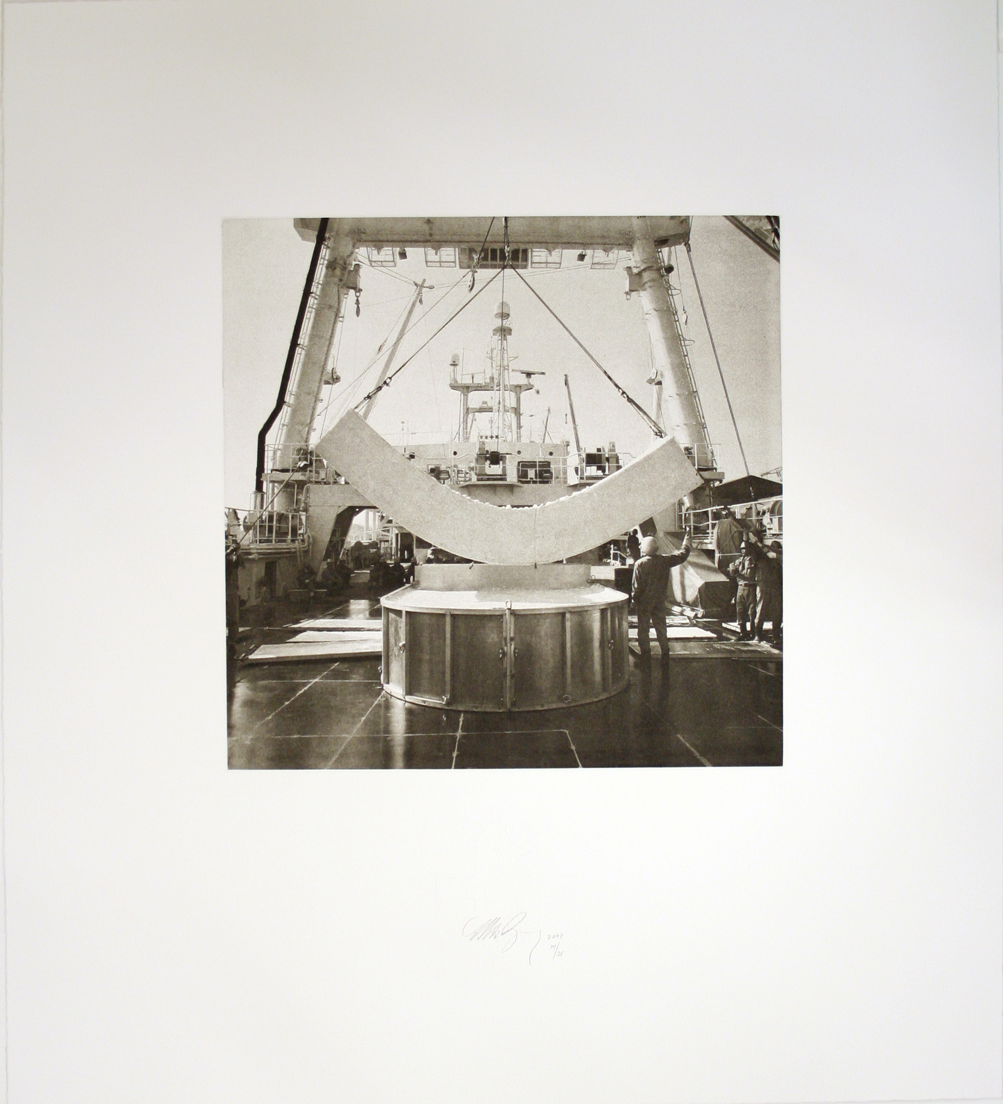 A photo features a boat with a white curved concrete structure suspended by two lines.