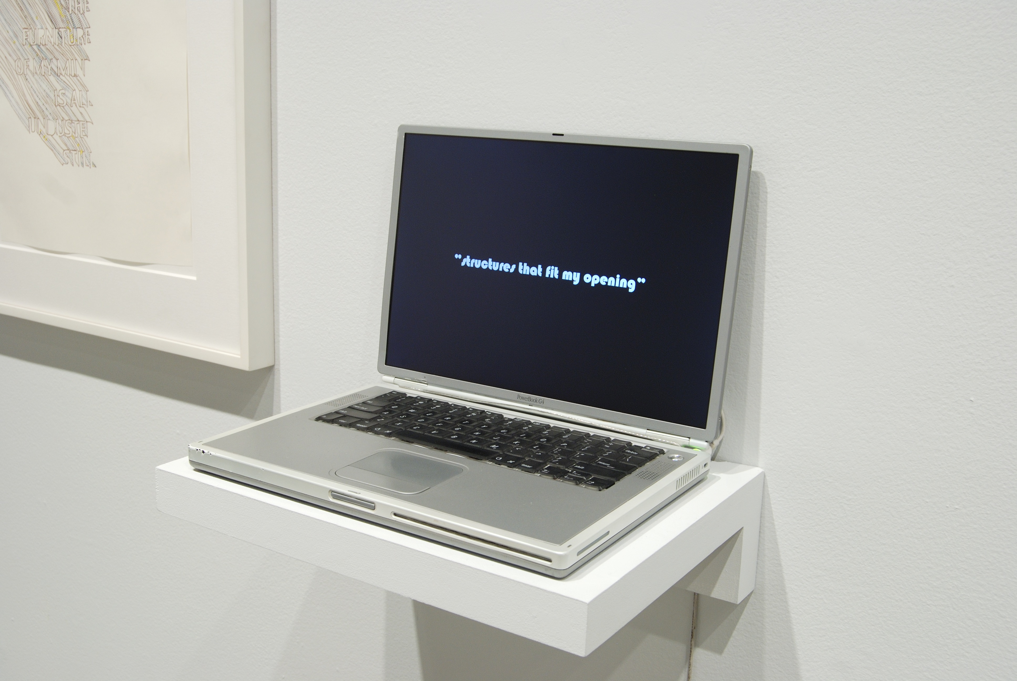 Laptop with black screen sits on a shelf. Screen reads &quot;Structures that fit my opening.&quot;