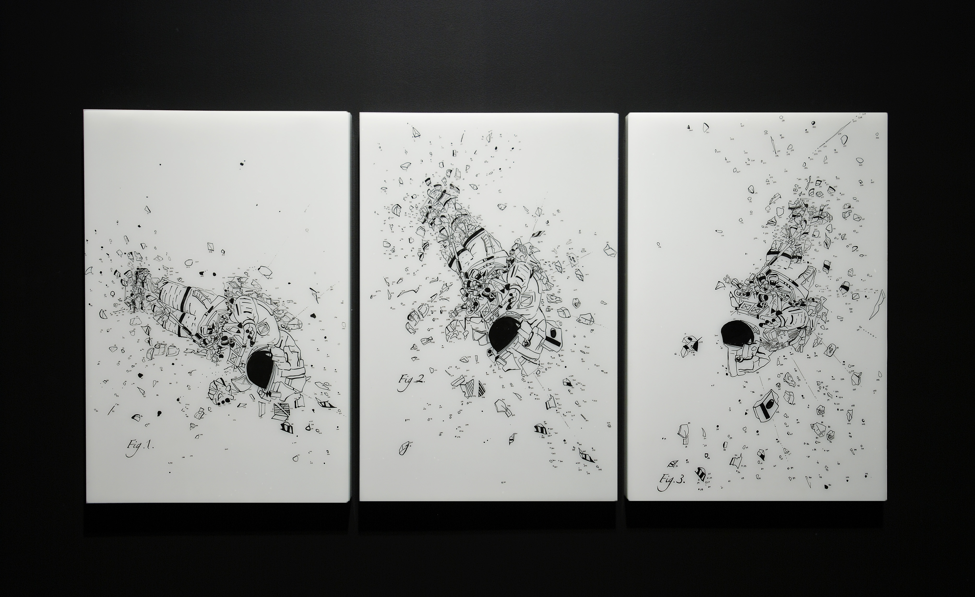 On a black wall, triptych, black and white drawings of an astronaut exploding in 3 different upside-down positions