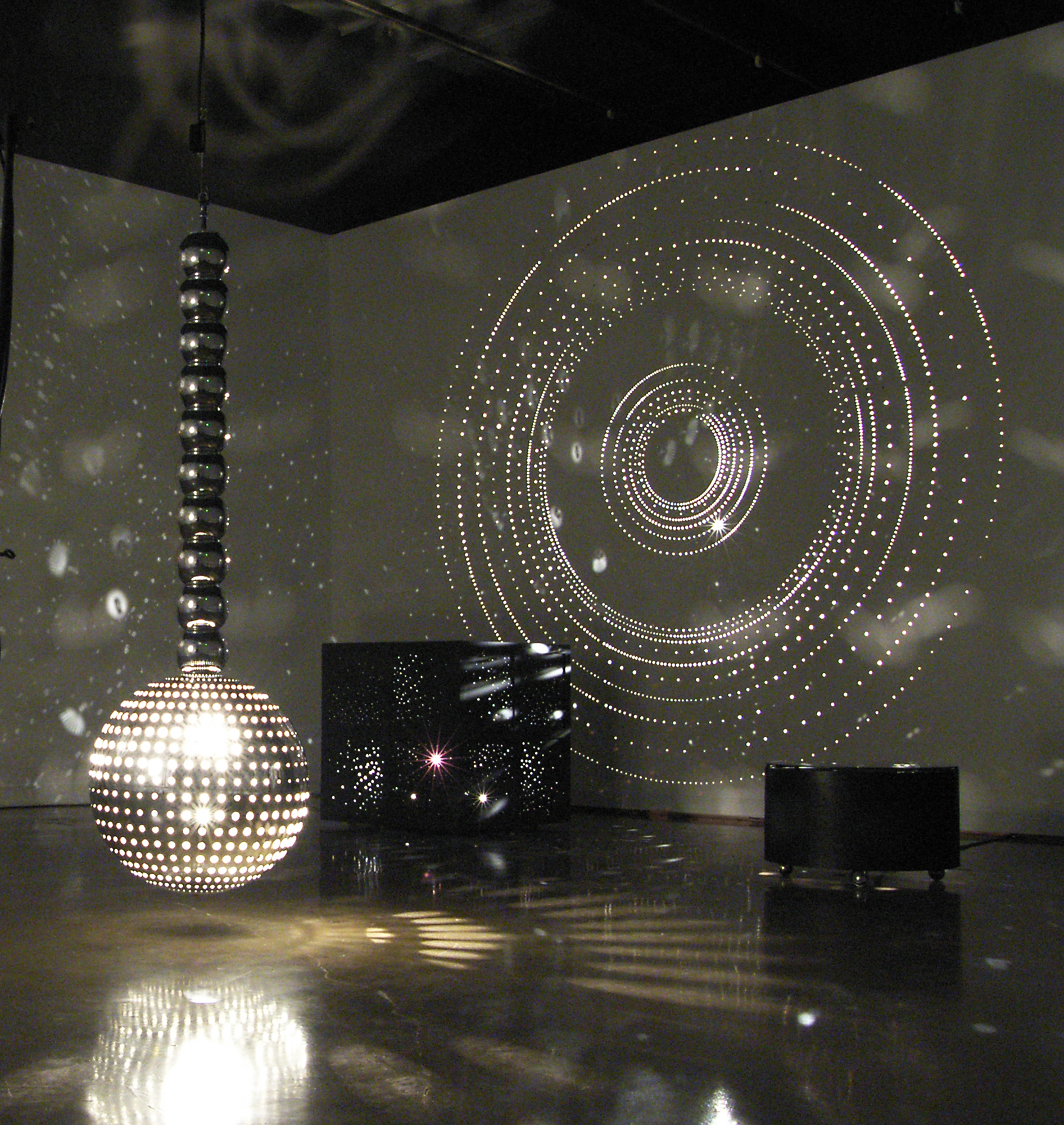 Large sculptures filling the gallery space with light.