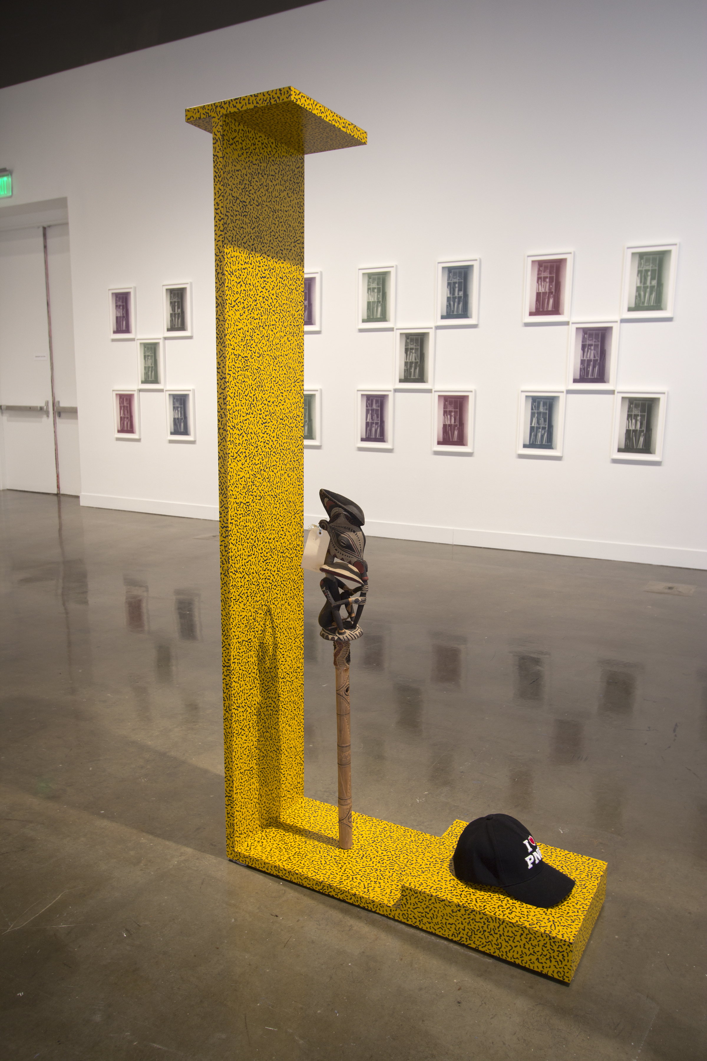 Yellow and black polk dot sculptural that stands 6' tall