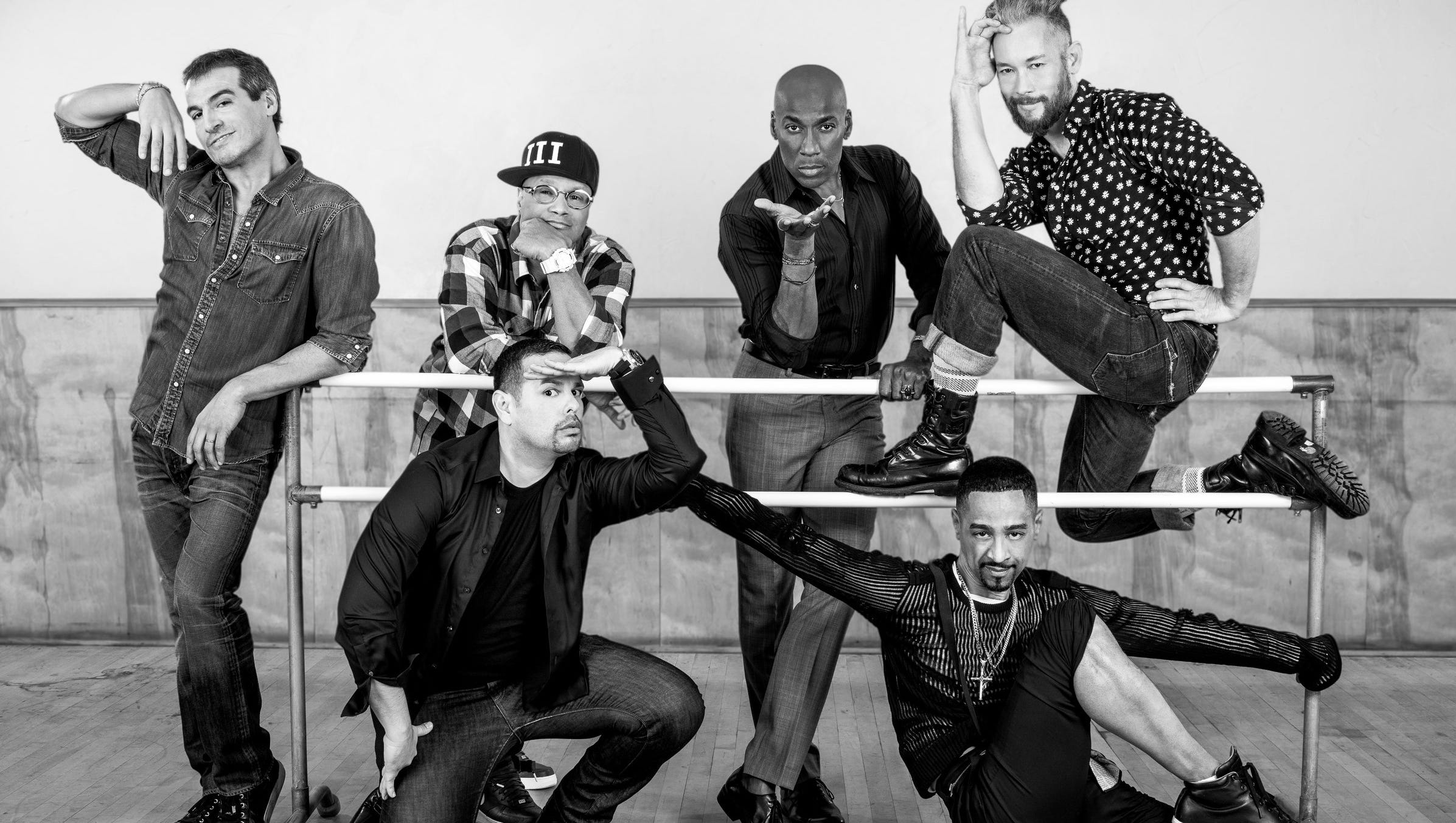 Black and white photo of Strike a Pose cast by ballet bars