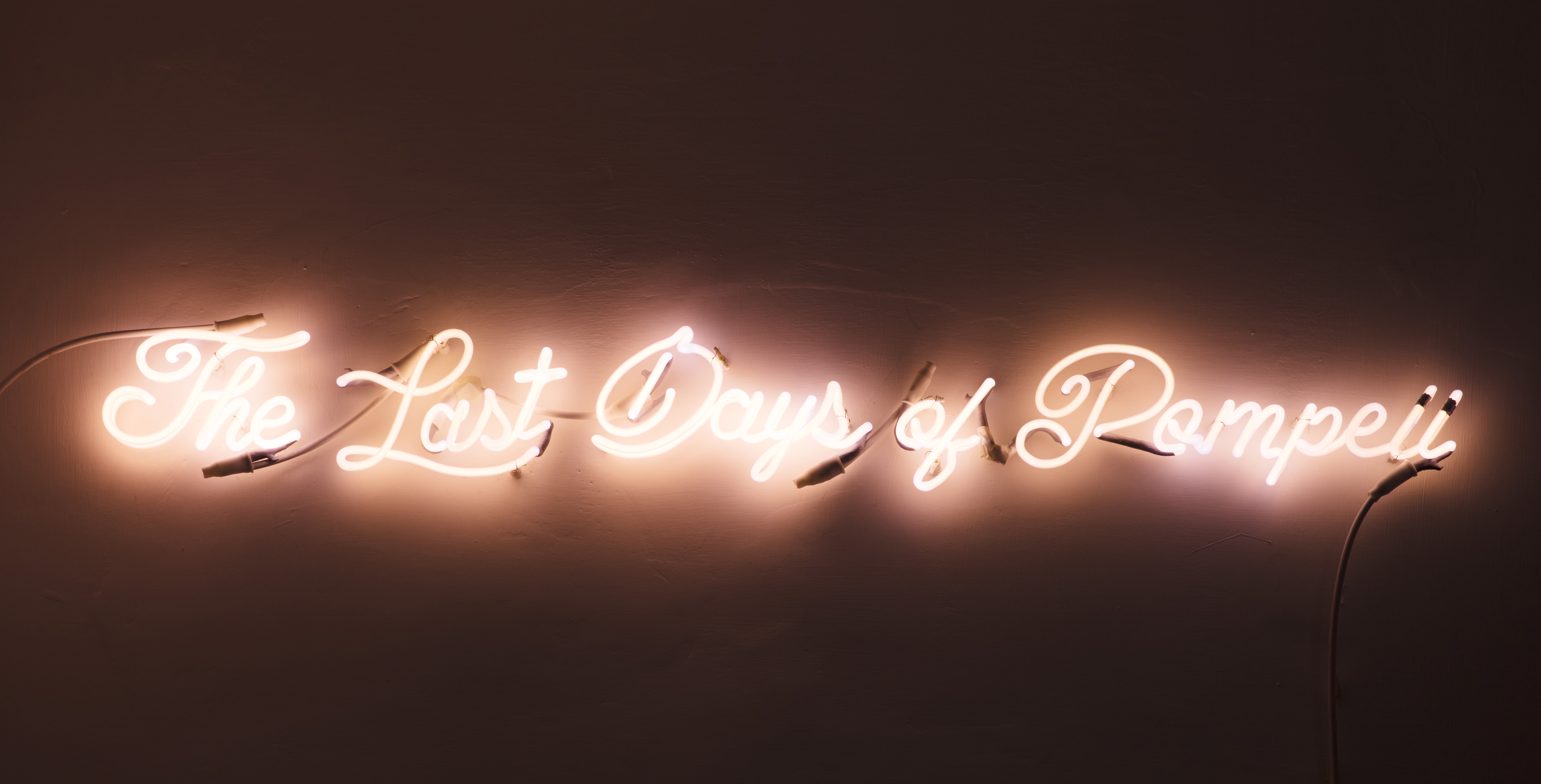 A pink neon sign says "The Last Days of Pompeii".