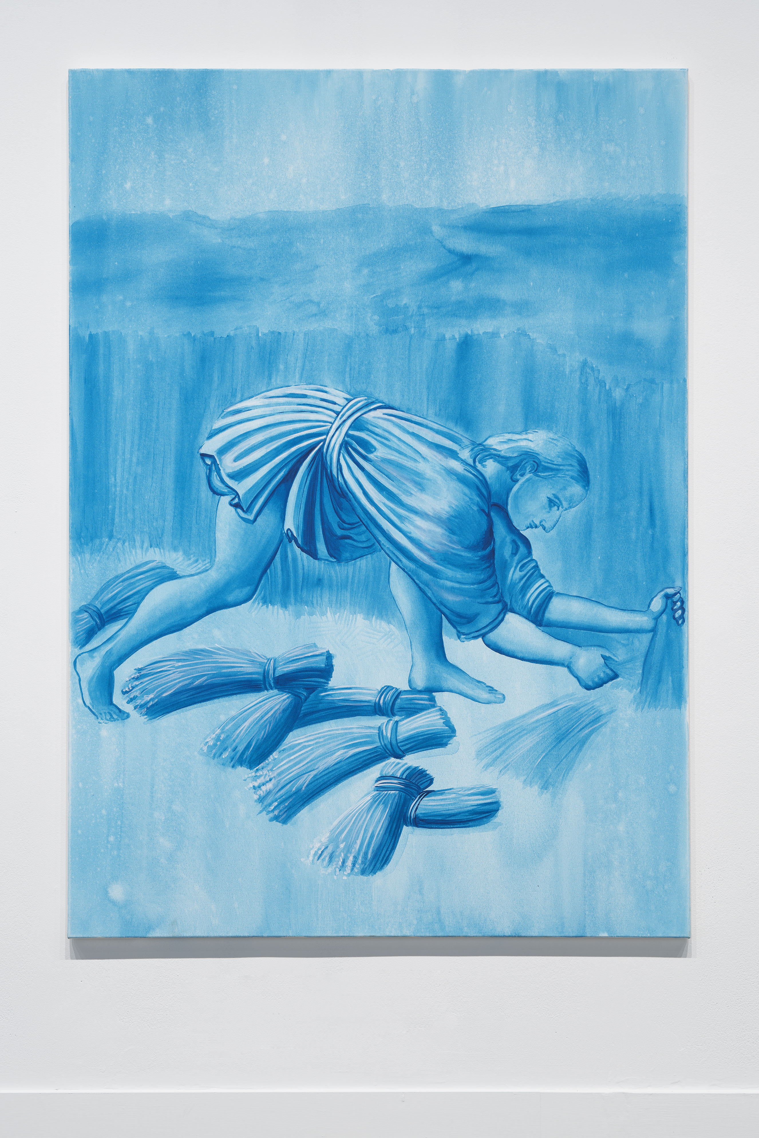 A blue monochromatic painting features a person gathering bunches of grass.