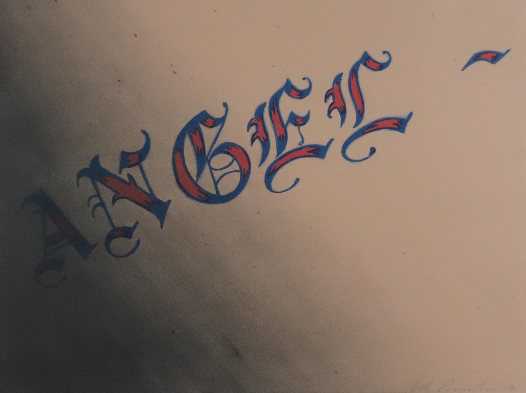 The word angel in a gothic style font with red and blue shading.