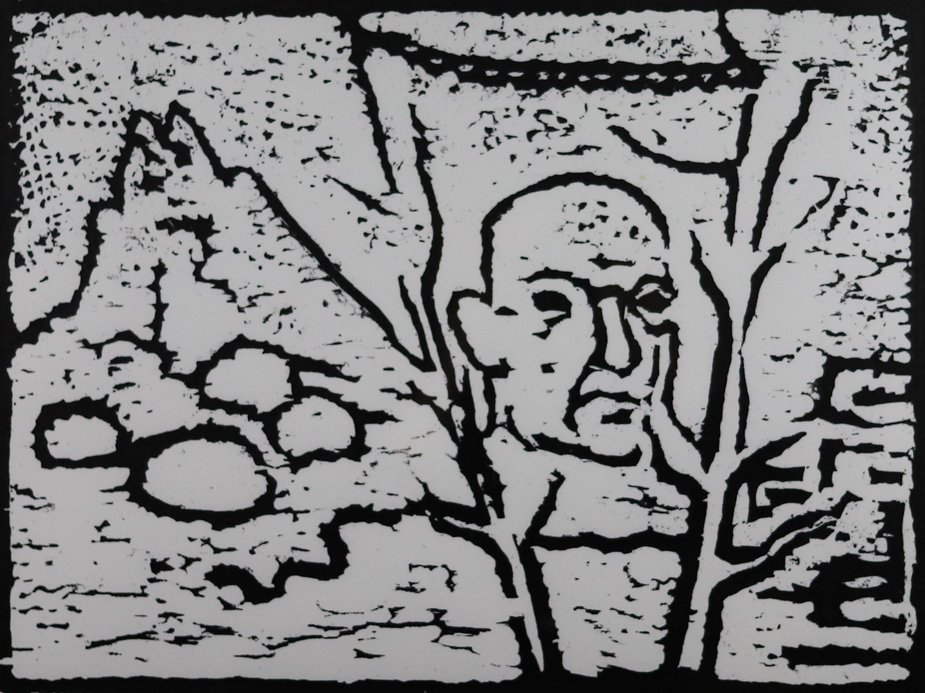Print of a mans face in the center with a mountain shape on the left and two tree branch shapes framing his face.