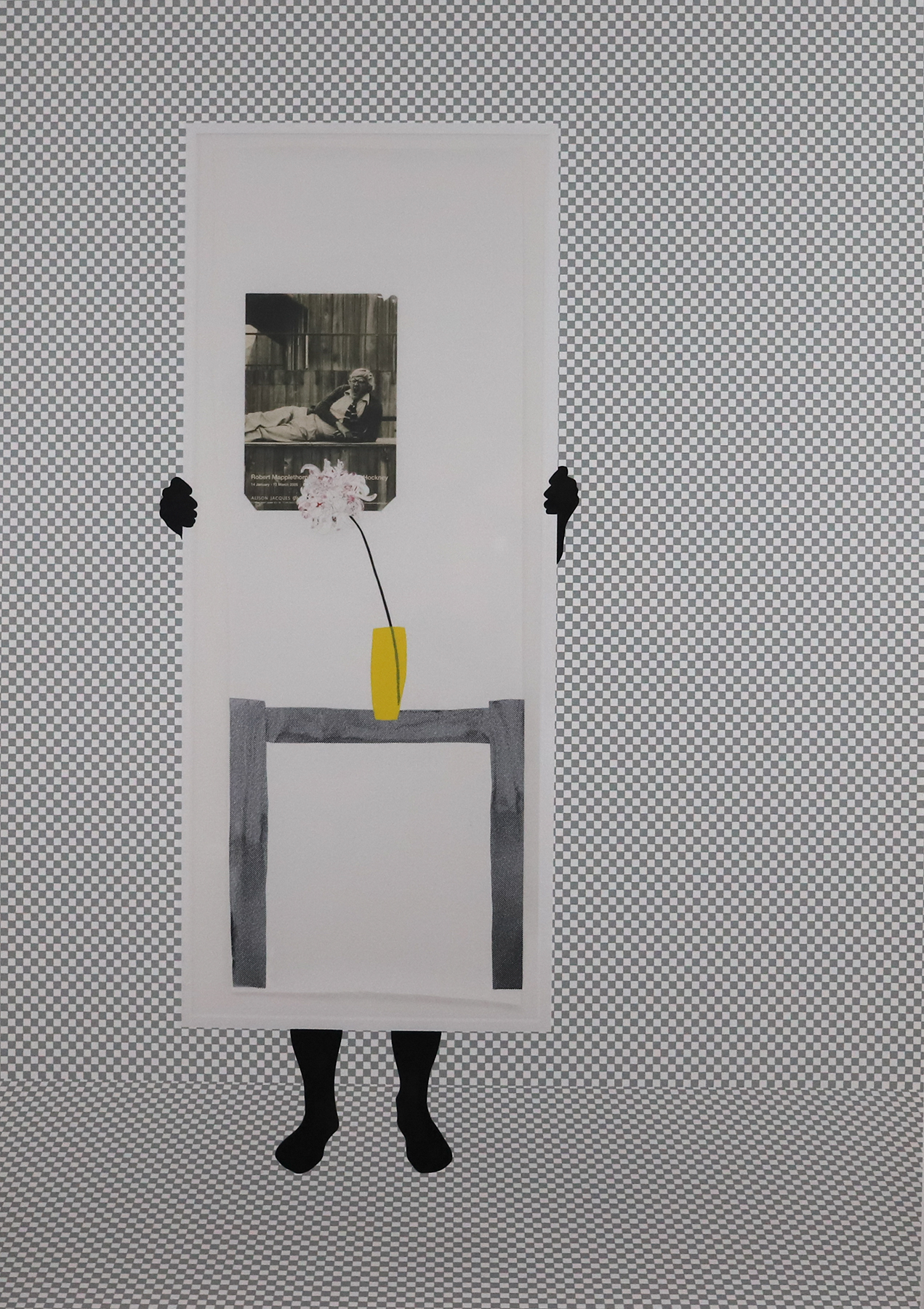 A dark figure holds a large white piece of cardboard with a collage on top including a small table, yellow vase and a flower.