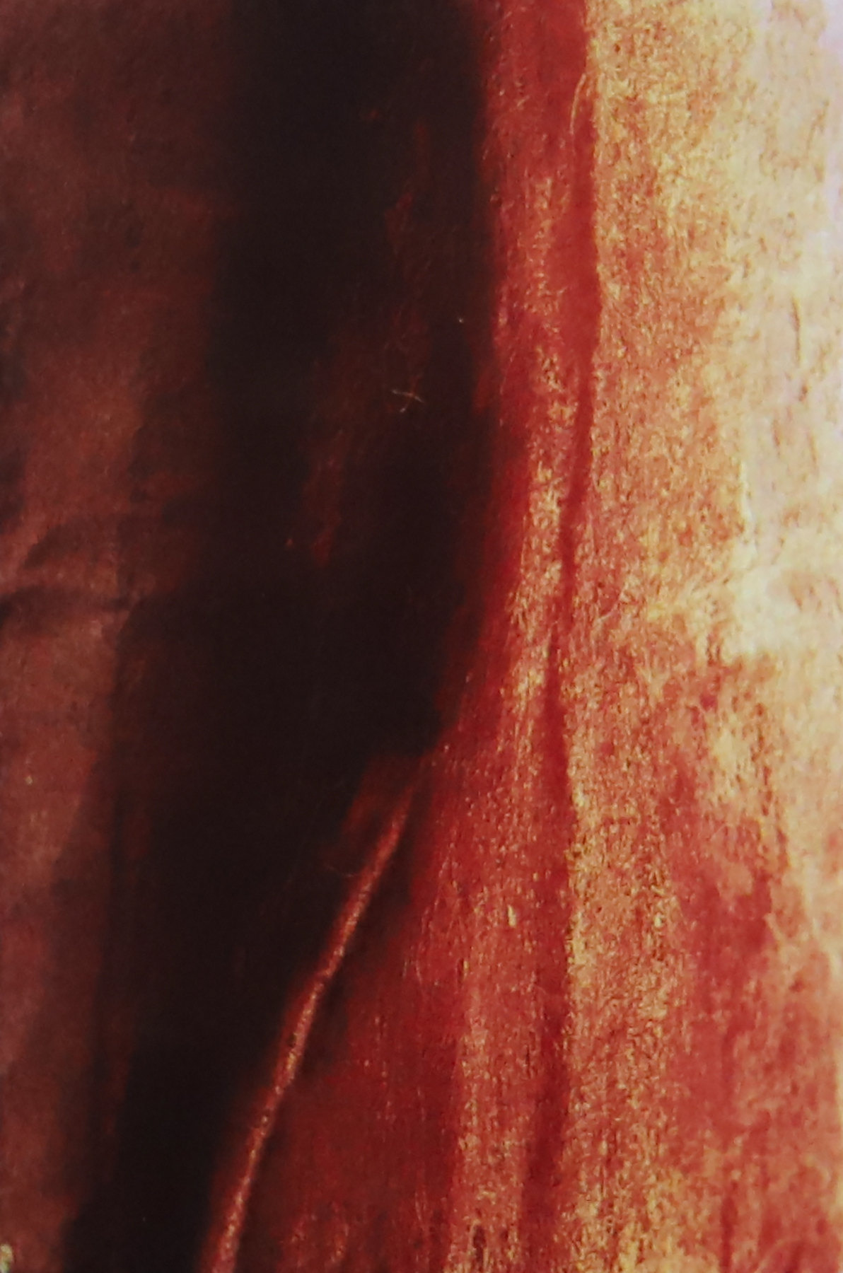 Maroon background that fades to lighter maroon from left to right and has an increasingly rough texture on the right.