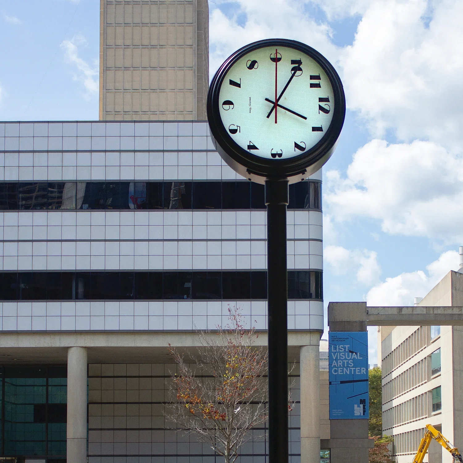 A black freestanding clock with a restrained modern design