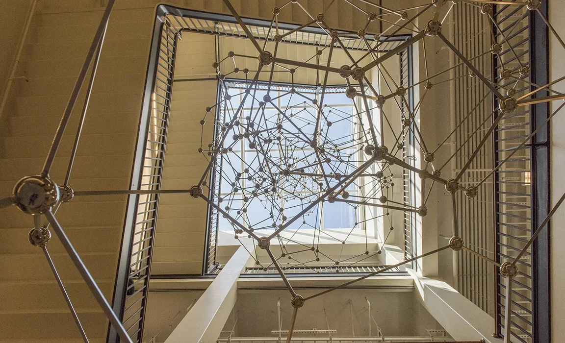 Sculpture made of thirty-three stainless steel polyhedrons reaching from the floor of the Simons Building to the skylight four stories above
