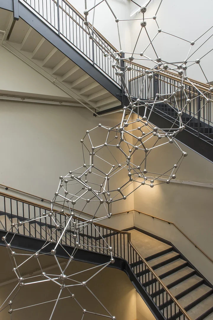 Sculpture made of thirty-three stainless steel polyhedrons reaching from the floor of the Simons Building to the skylight four stories above