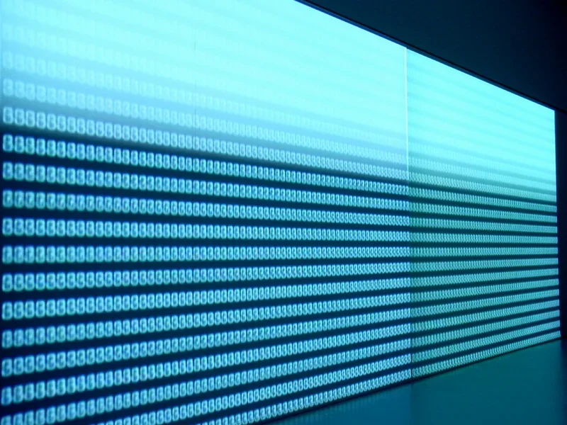 Bright blue dot lighting lining an entire wall