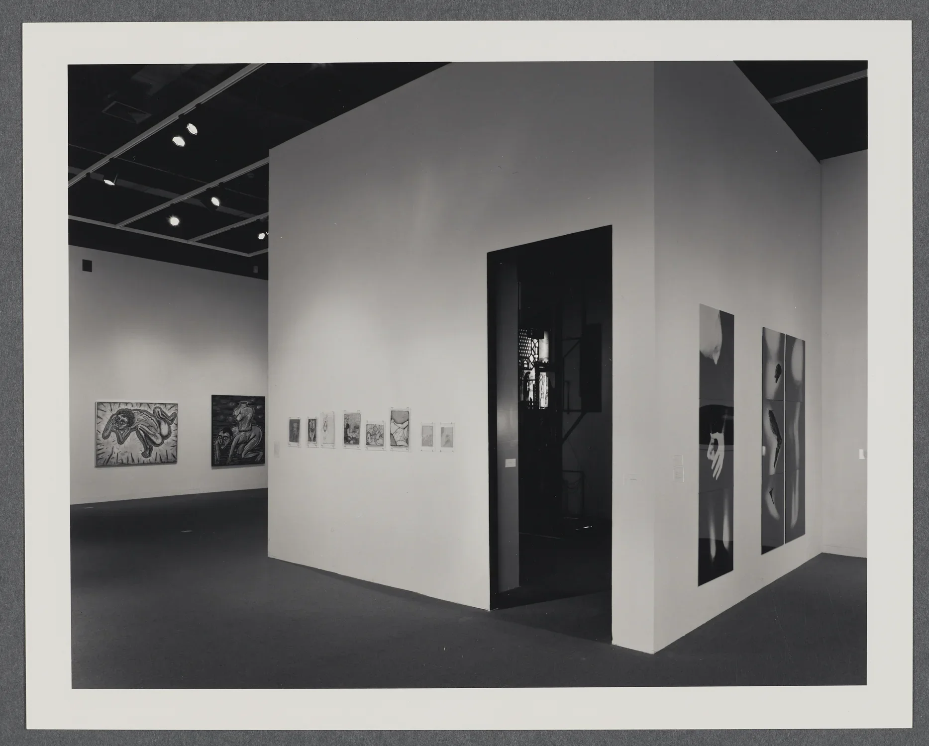 A smaller room within the gallery holds an installation while 2 dimensional works hang on the gallery walls. 