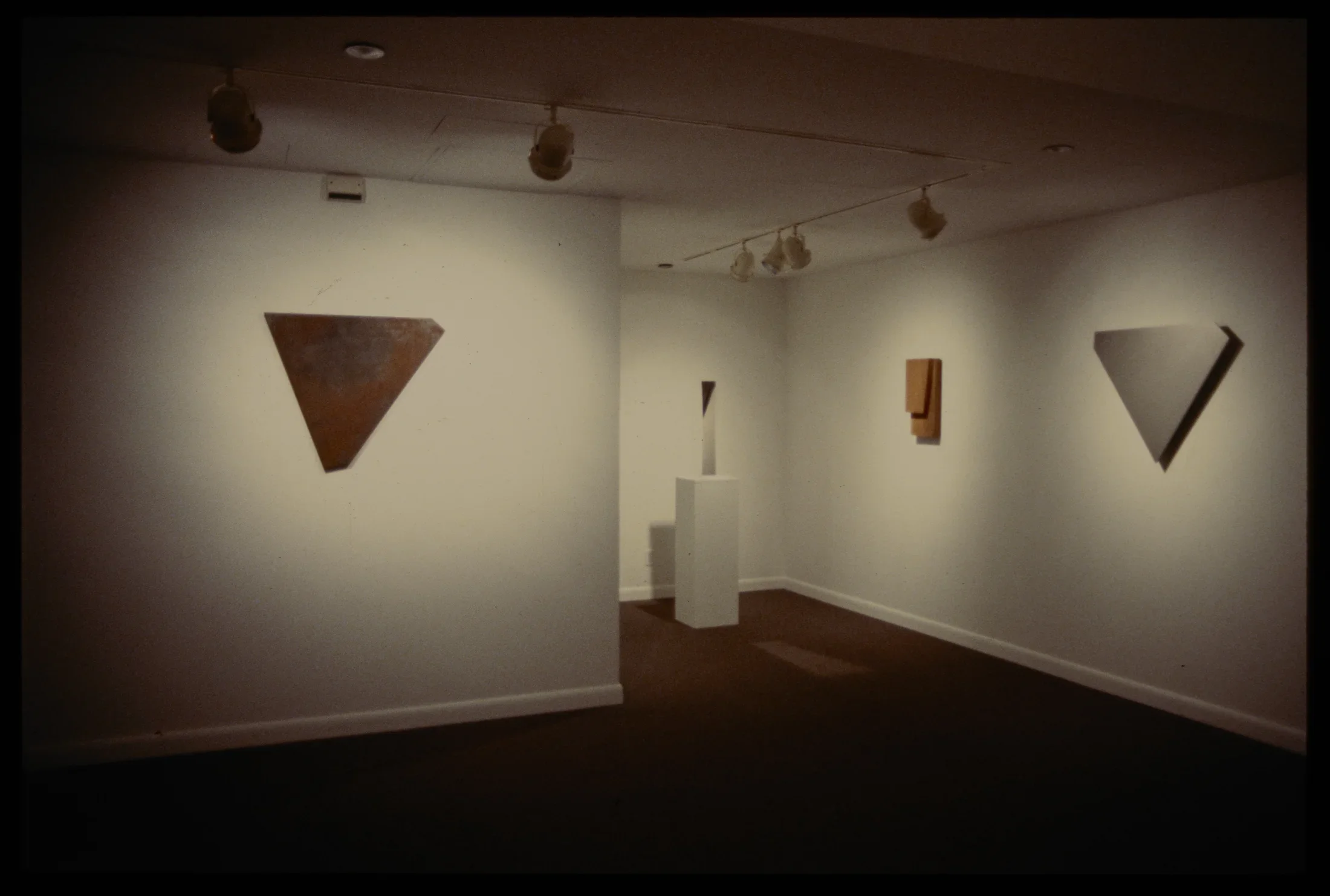 Form studies are both hanging on the walls and displayed on pedestals. Each study has its own unique shape and form.