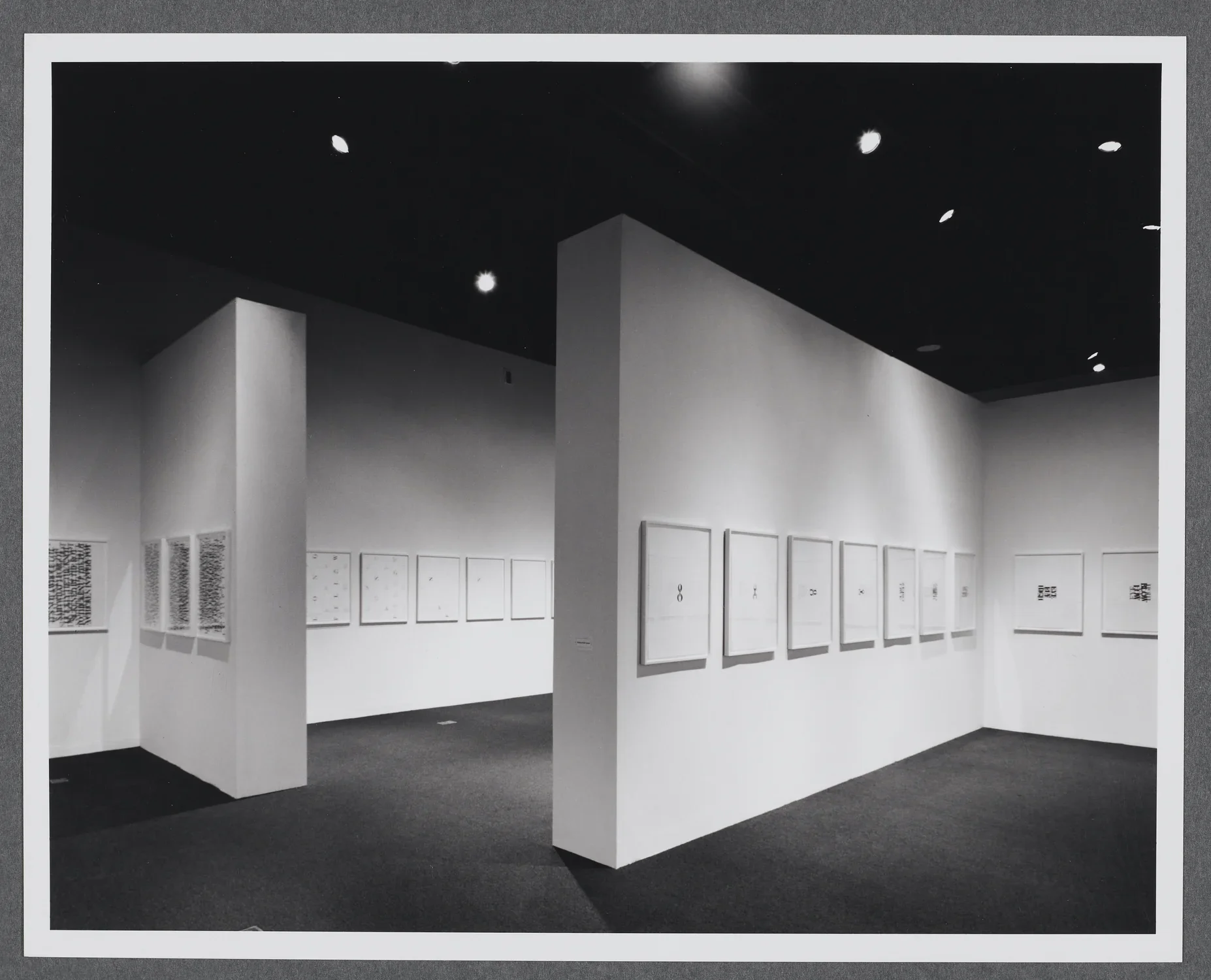 Works of the same size are displayed in a row that goes all around the gallery. Gallery walls create extra space within the room.