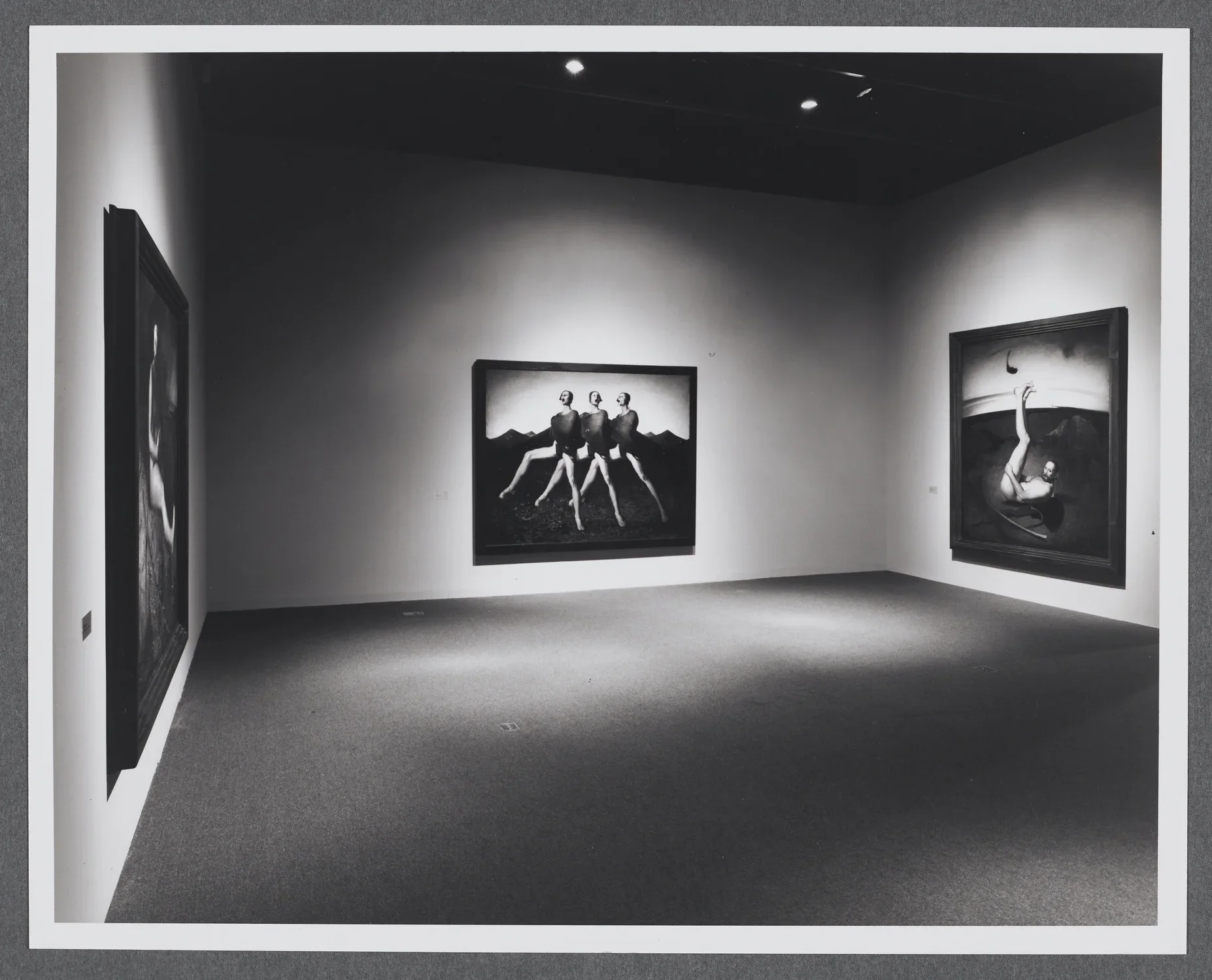 Large figurative paintings take up the gallery. Each painting has figures in a variety of poses and in different settings.