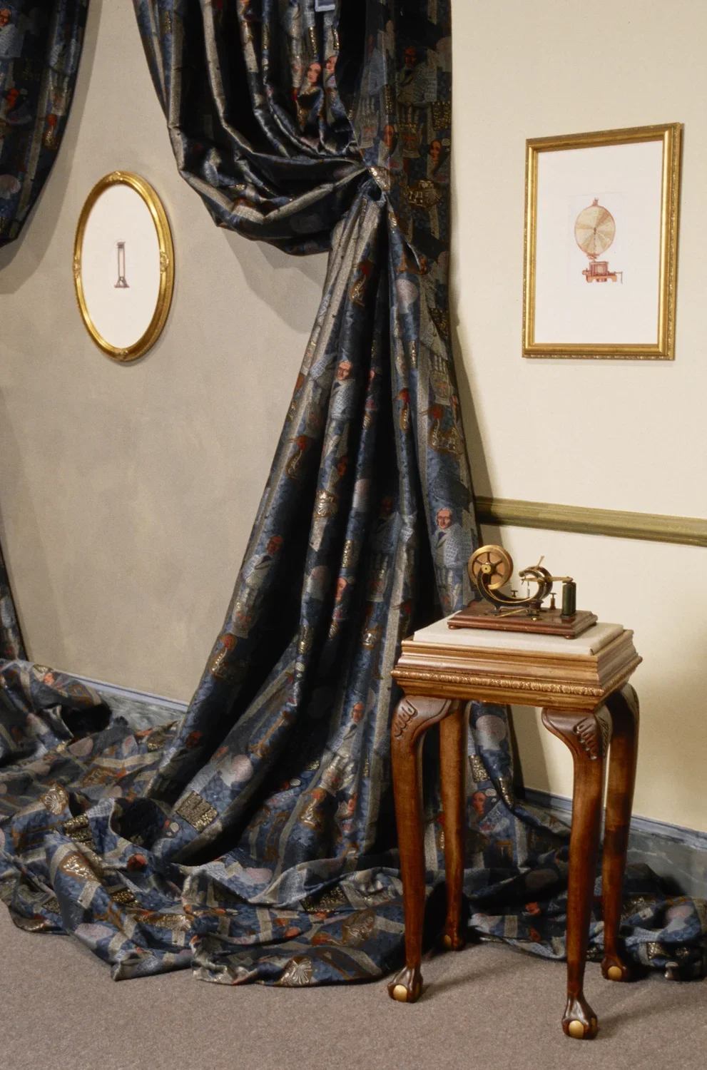 Telegraph on display table, 2 illustrations in gilded frames and drapery made of Jacquard fabric, woven for the exhibition