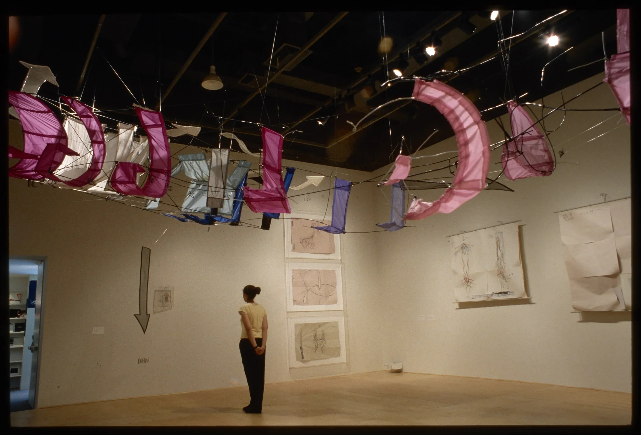 Large banners in red and white that appear to form the shape of a flying machine.