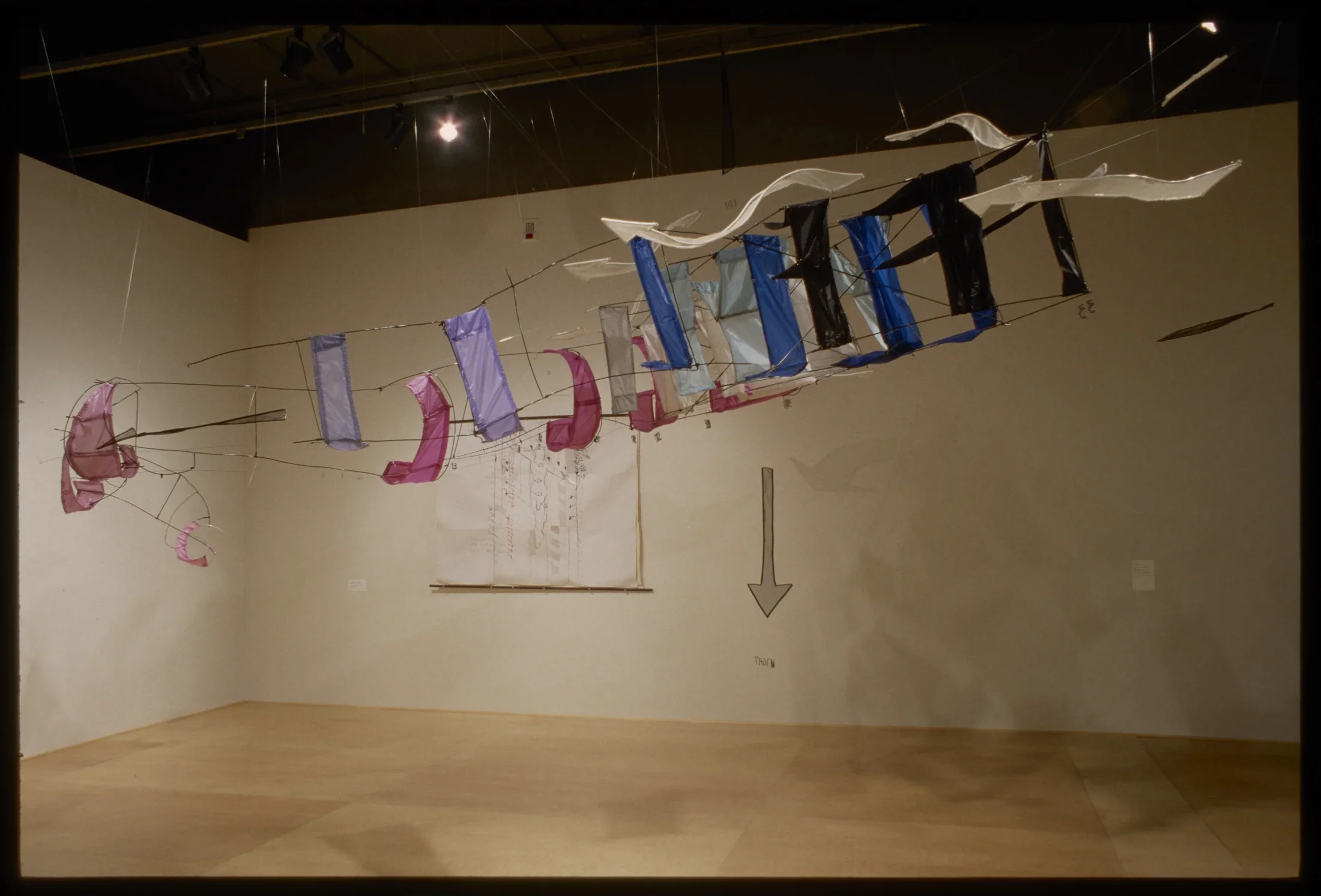 Large banners in red and white that appear to form the shape of a flying machine.