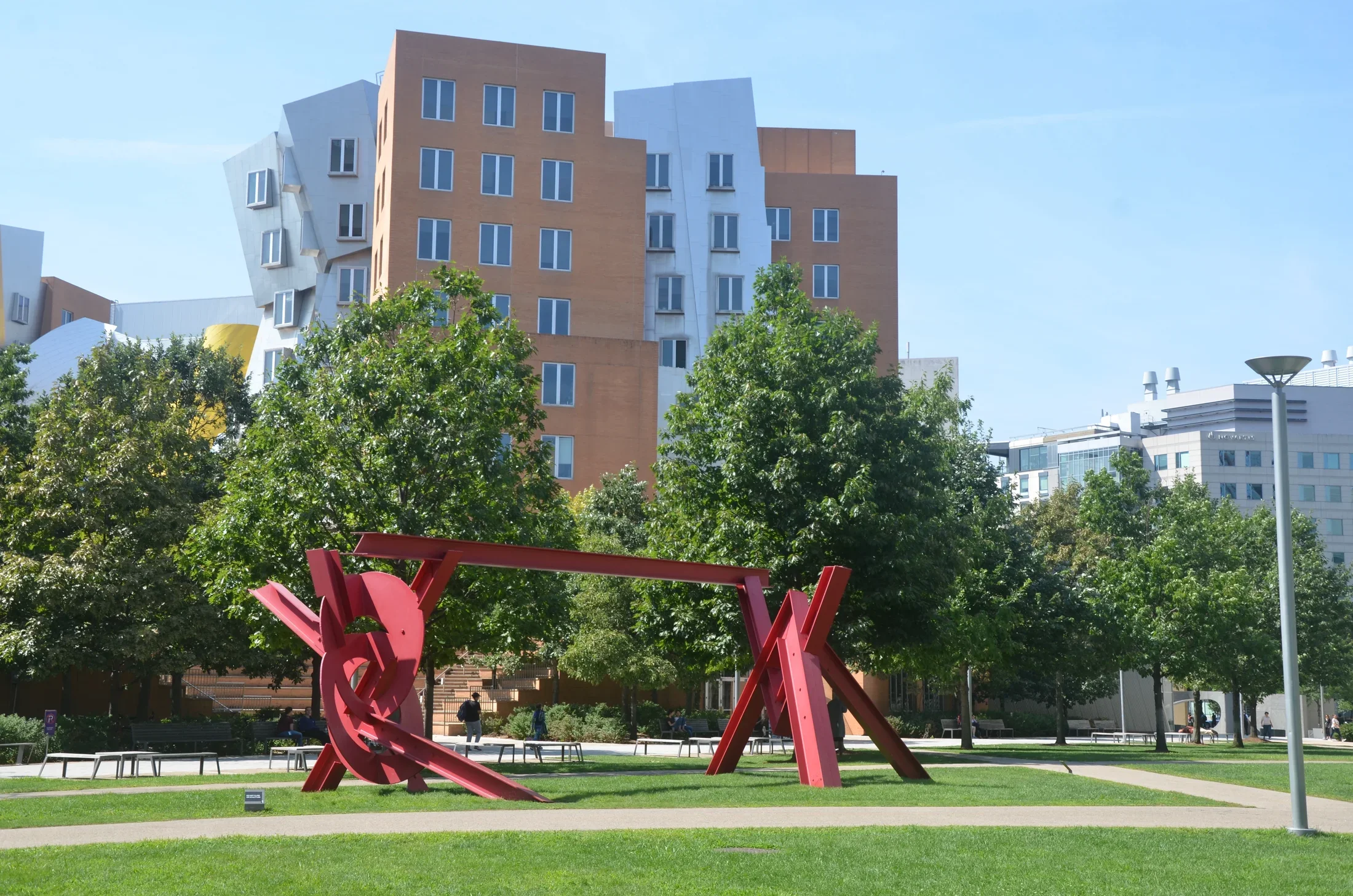 Mark di Suvero's red public art piece is featured on MIT campus.