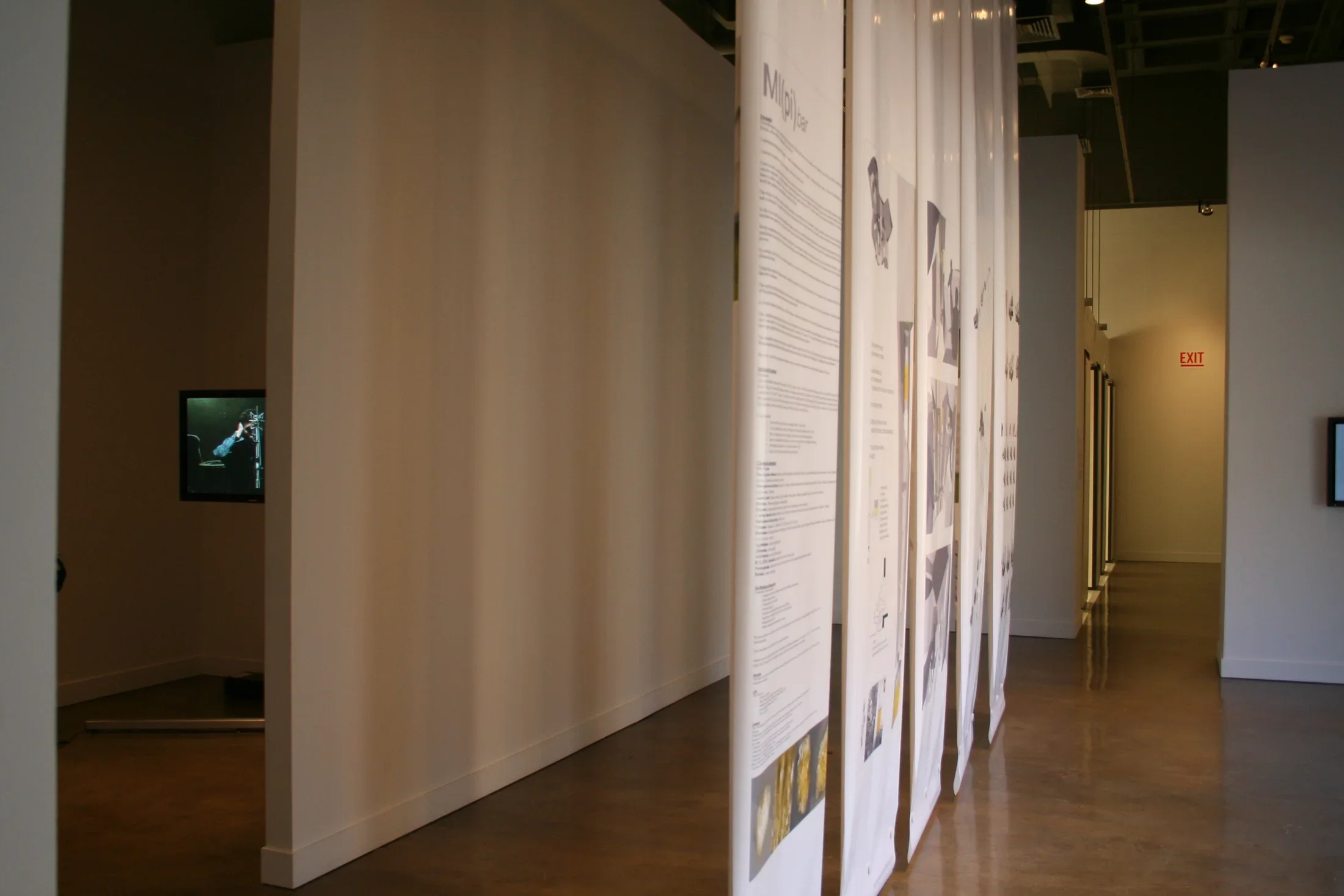Side angle view of fabric banners hanging from the ceiling. 