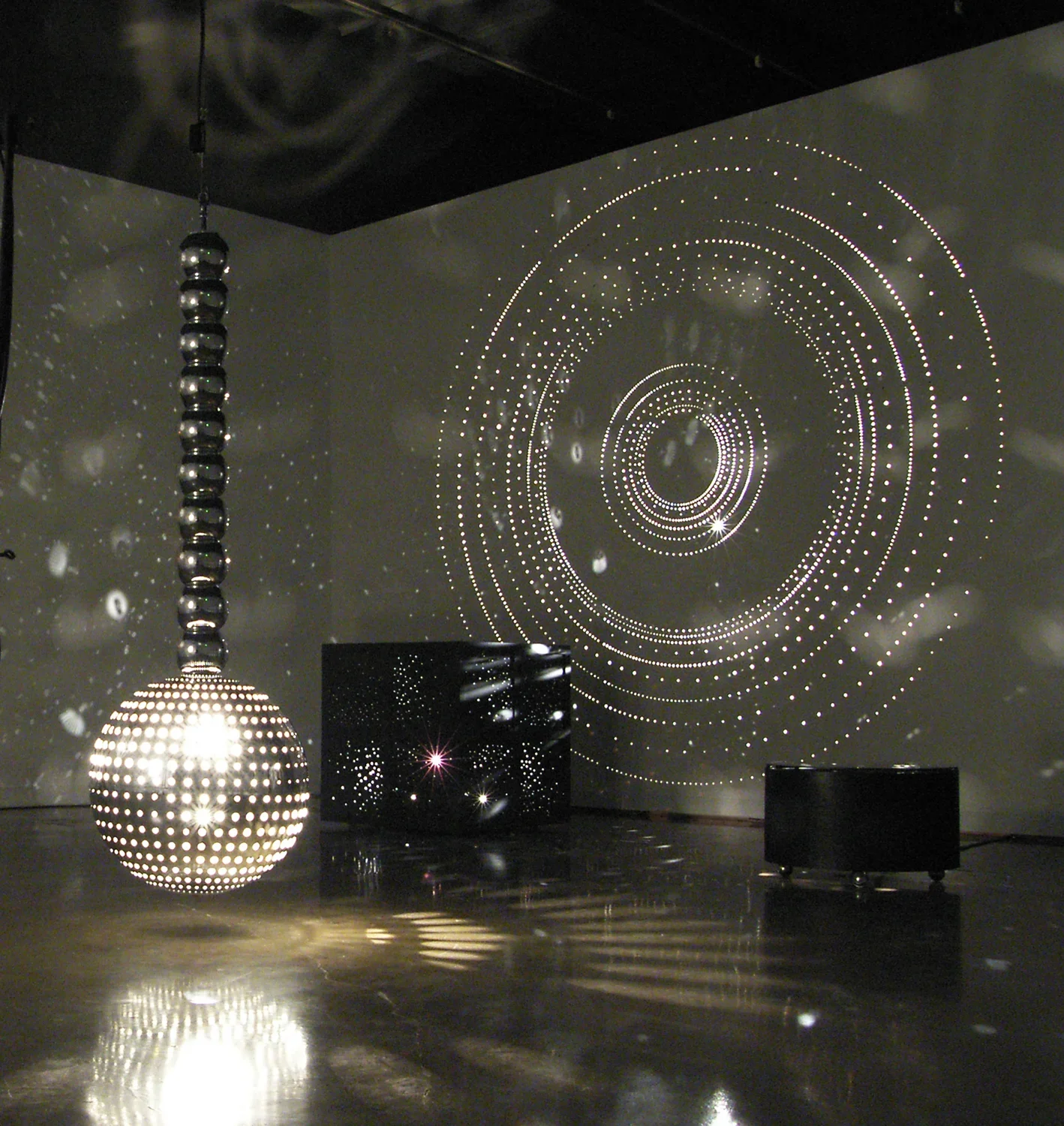 Large sculptures filling the gallery space with light.